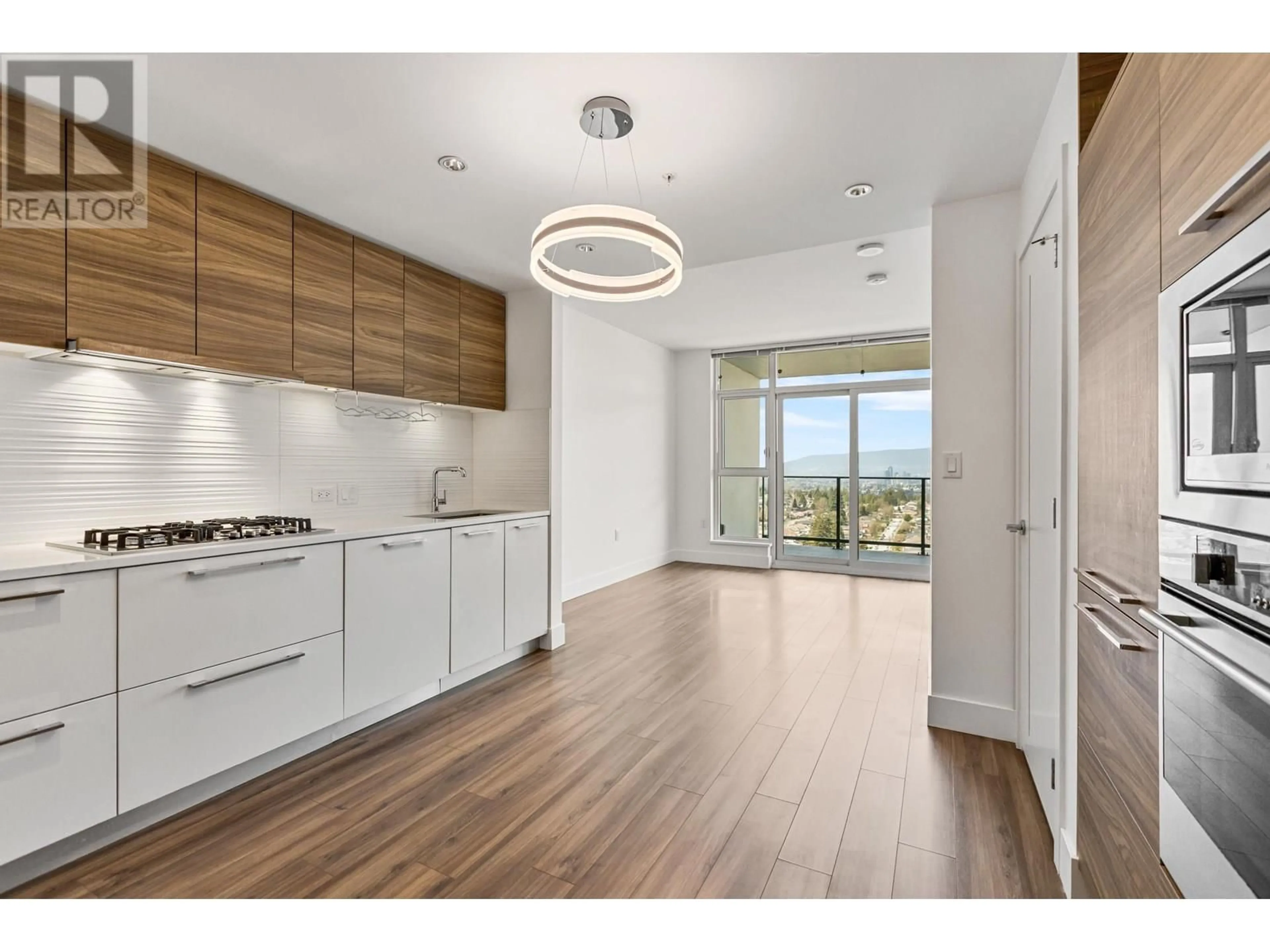 Open concept kitchen, wood/laminate floor for 2303 - 7303 NOBLE LANE, Burnaby British Columbia V3N0H2