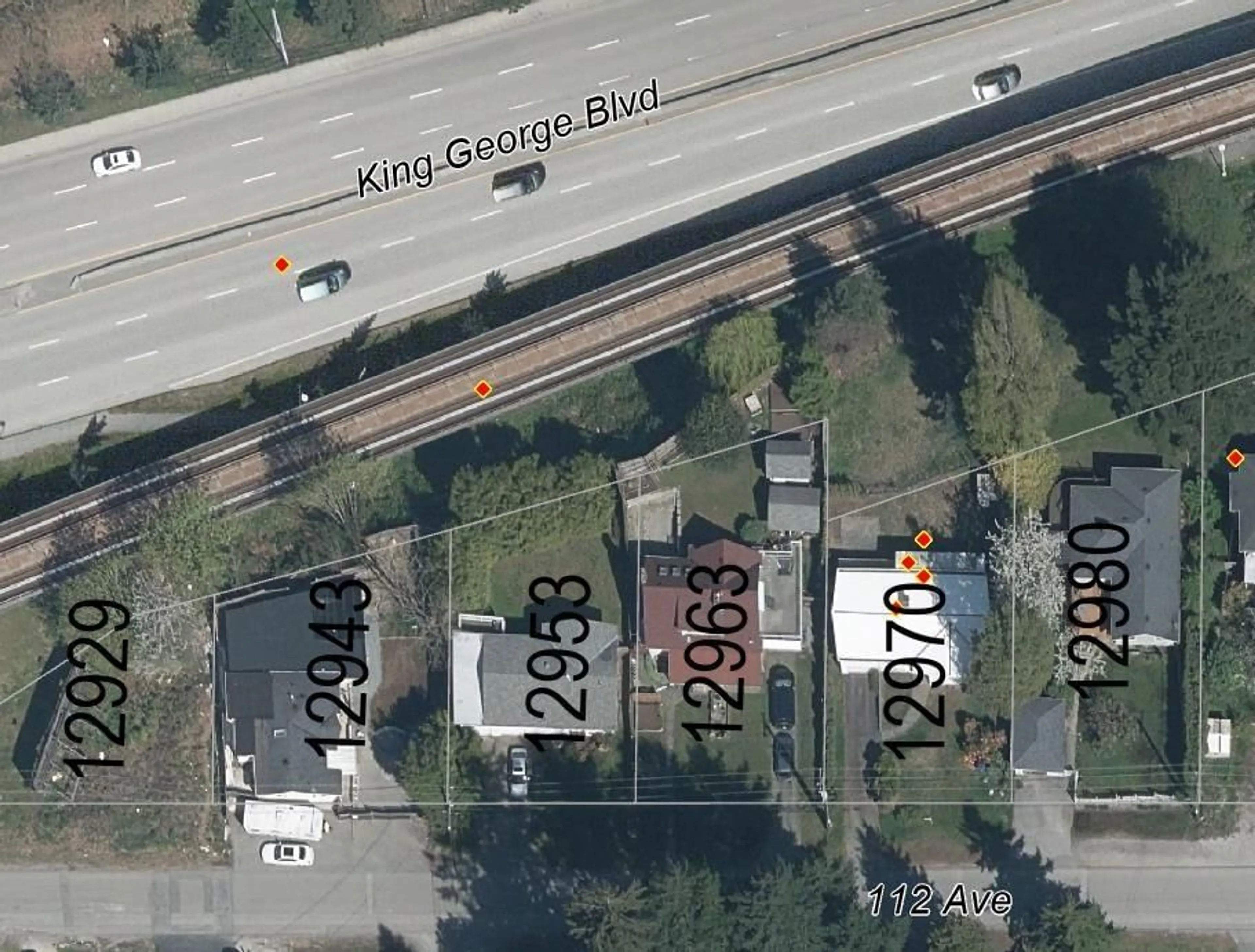 A pic from outside/outdoor area/front of a property/back of a property/a pic from drone, street for 12970 112A, Surrey British Columbia V3T2S8