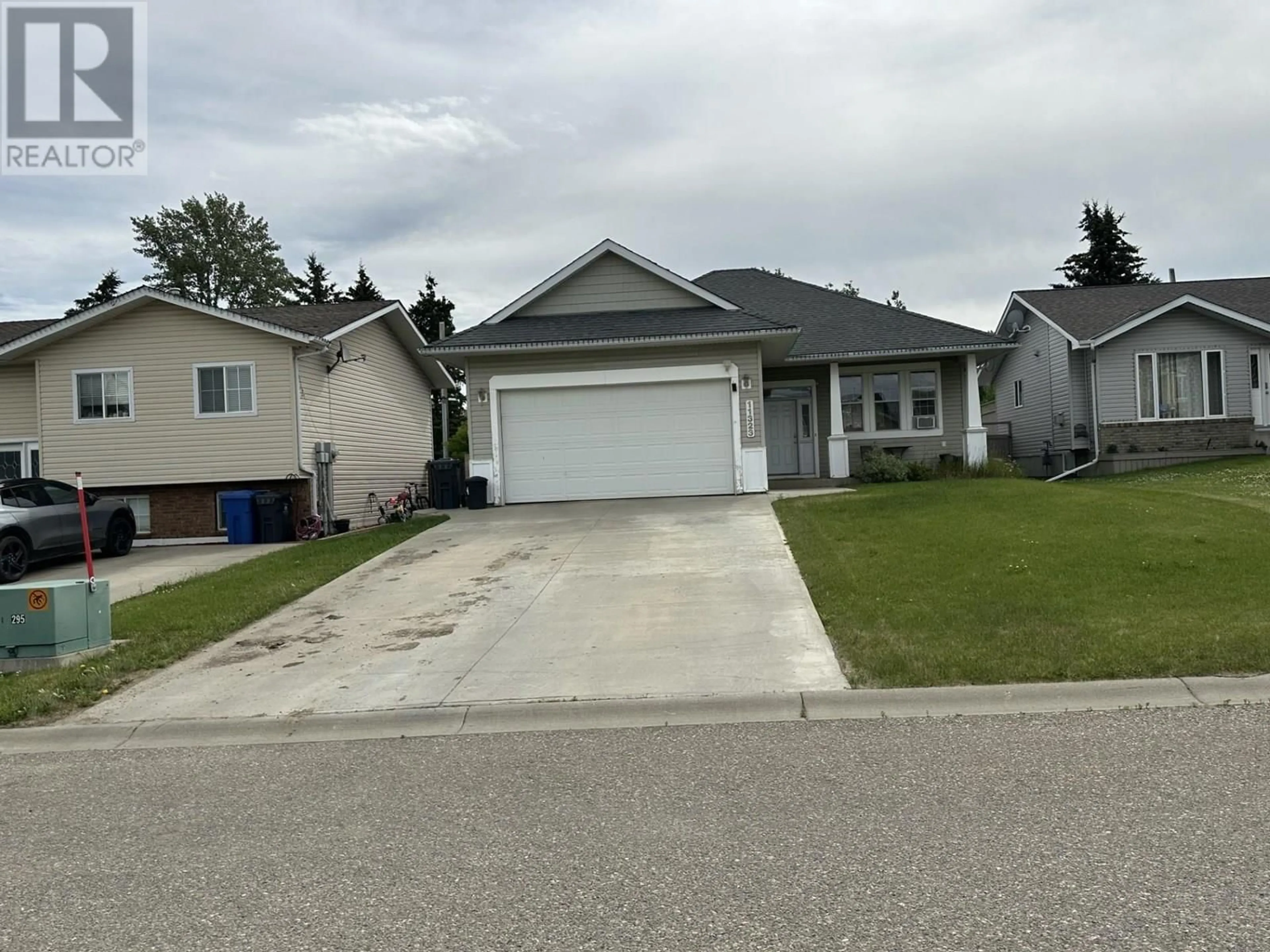 Home with vinyl exterior material, street for 11323 96A STREET, Fort St. John British Columbia V1J7E5