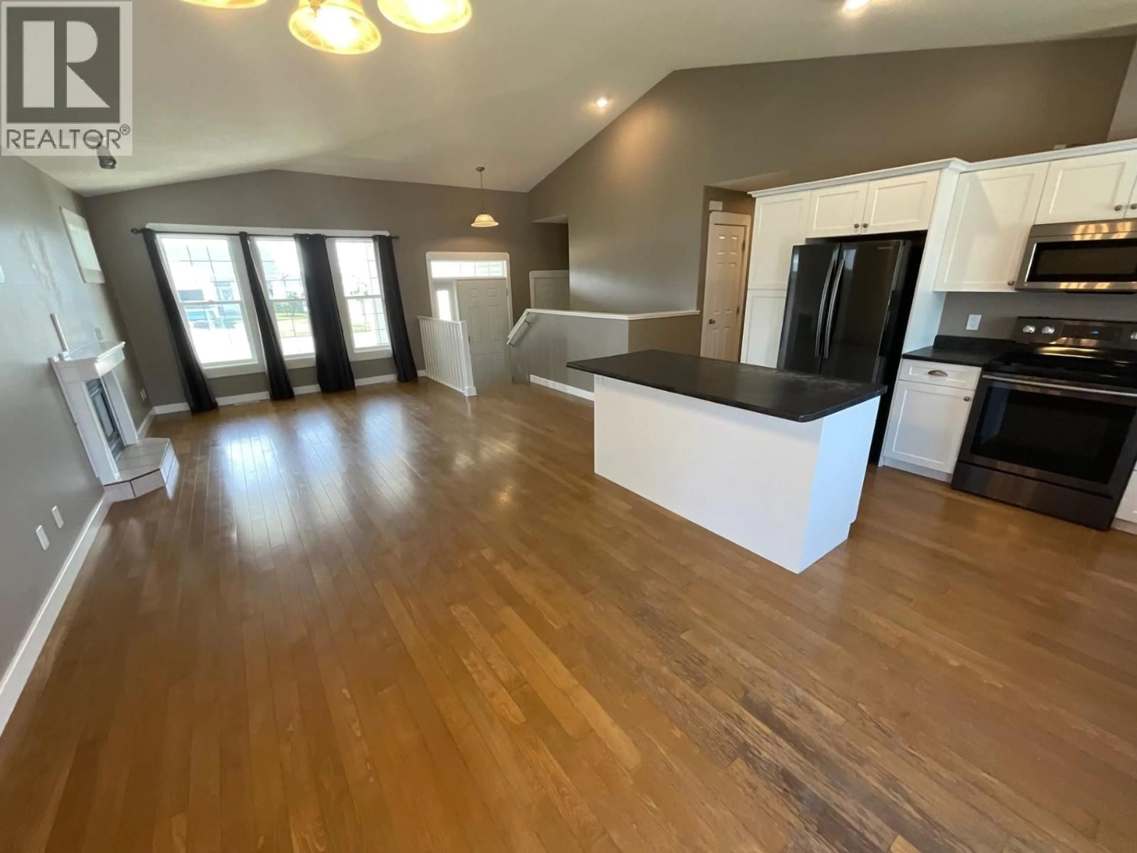 Open concept kitchen, wood/laminate floor for 11323 96A STREET, Fort St. John British Columbia V1J7E5