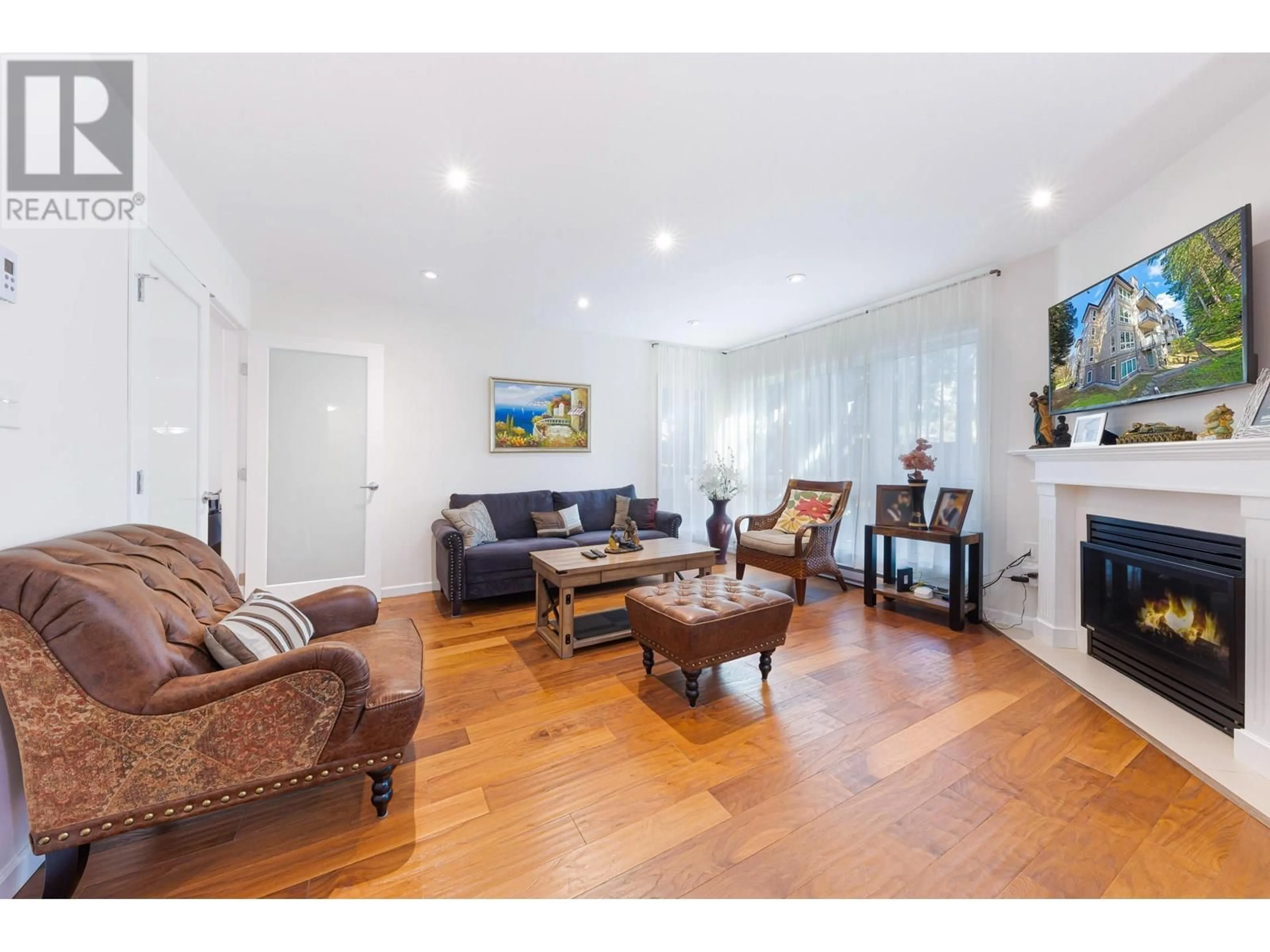 Living room with furniture, wood/laminate floor for 303 - 3950 LINWOOD STREET, Burnaby British Columbia V5G4R5