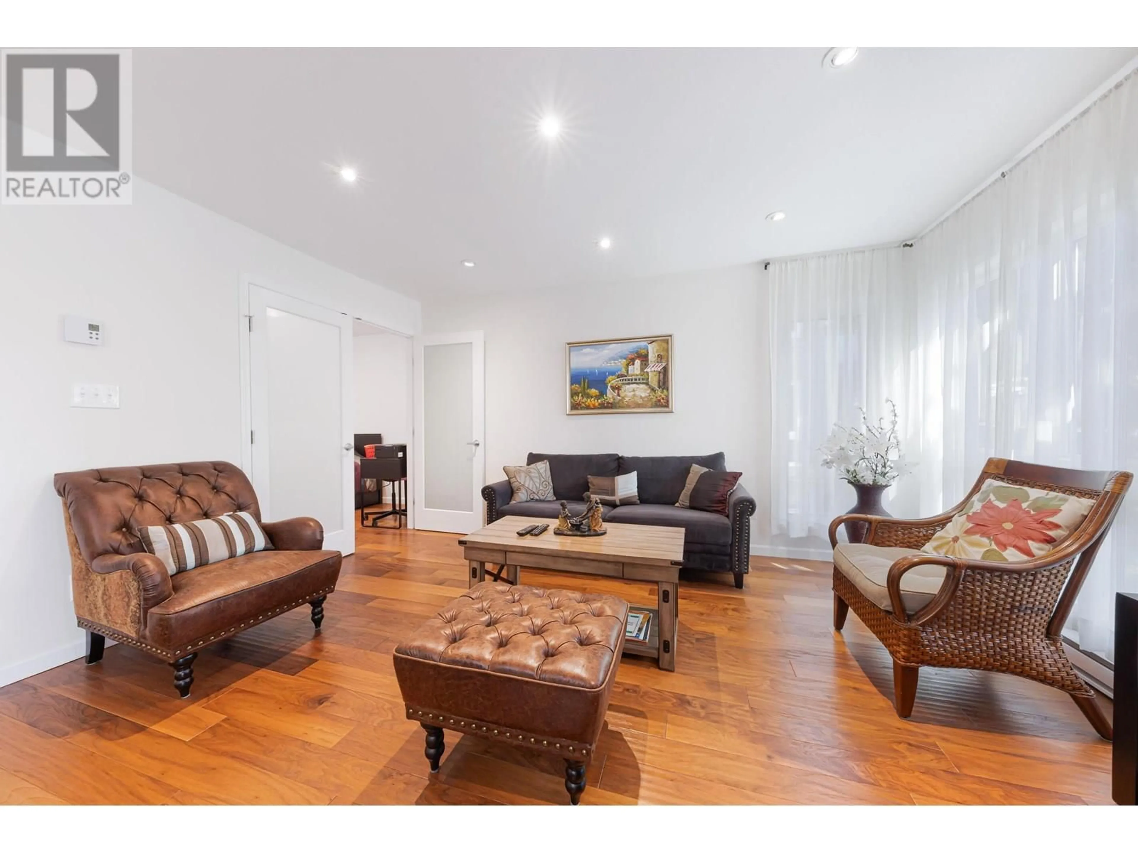 Living room with furniture, wood/laminate floor for 303 - 3950 LINWOOD STREET, Burnaby British Columbia V5G4R5