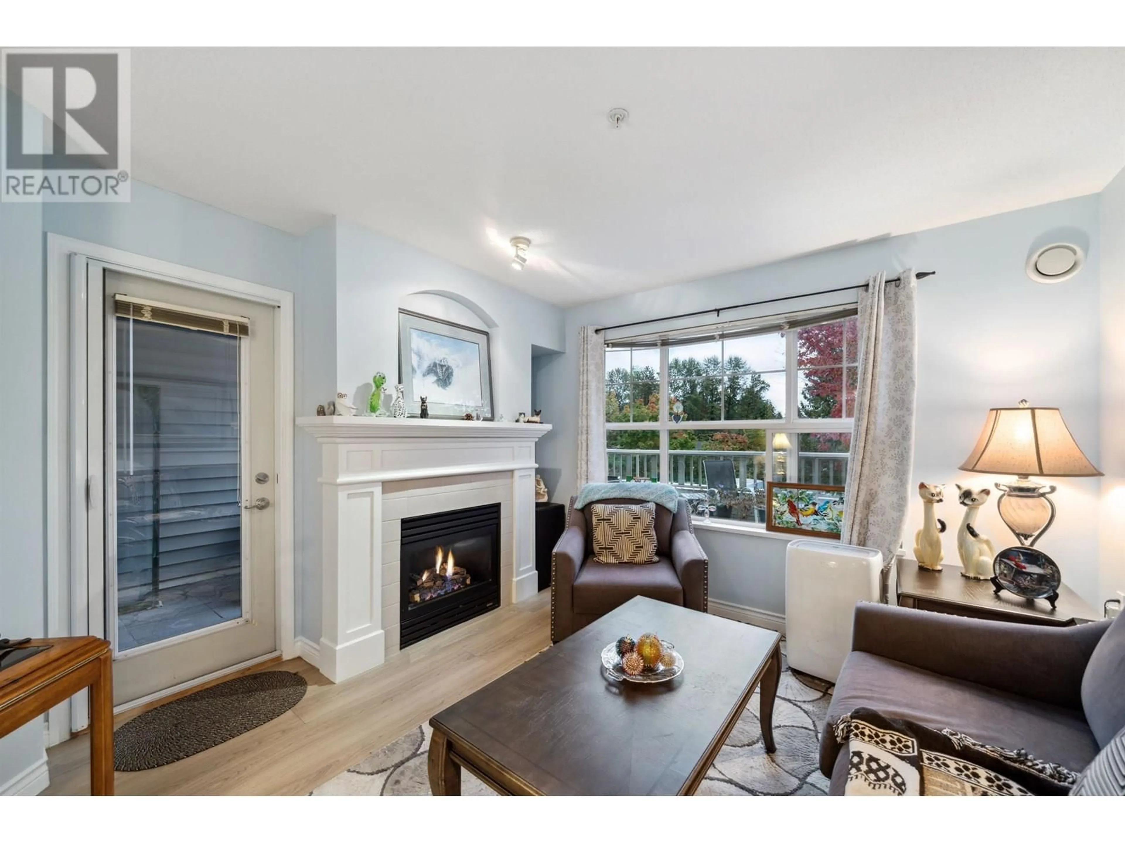 Living room with furniture, unknown for 202 - 960 LYNN VALLEY ROAD, North Vancouver British Columbia V7J3V6