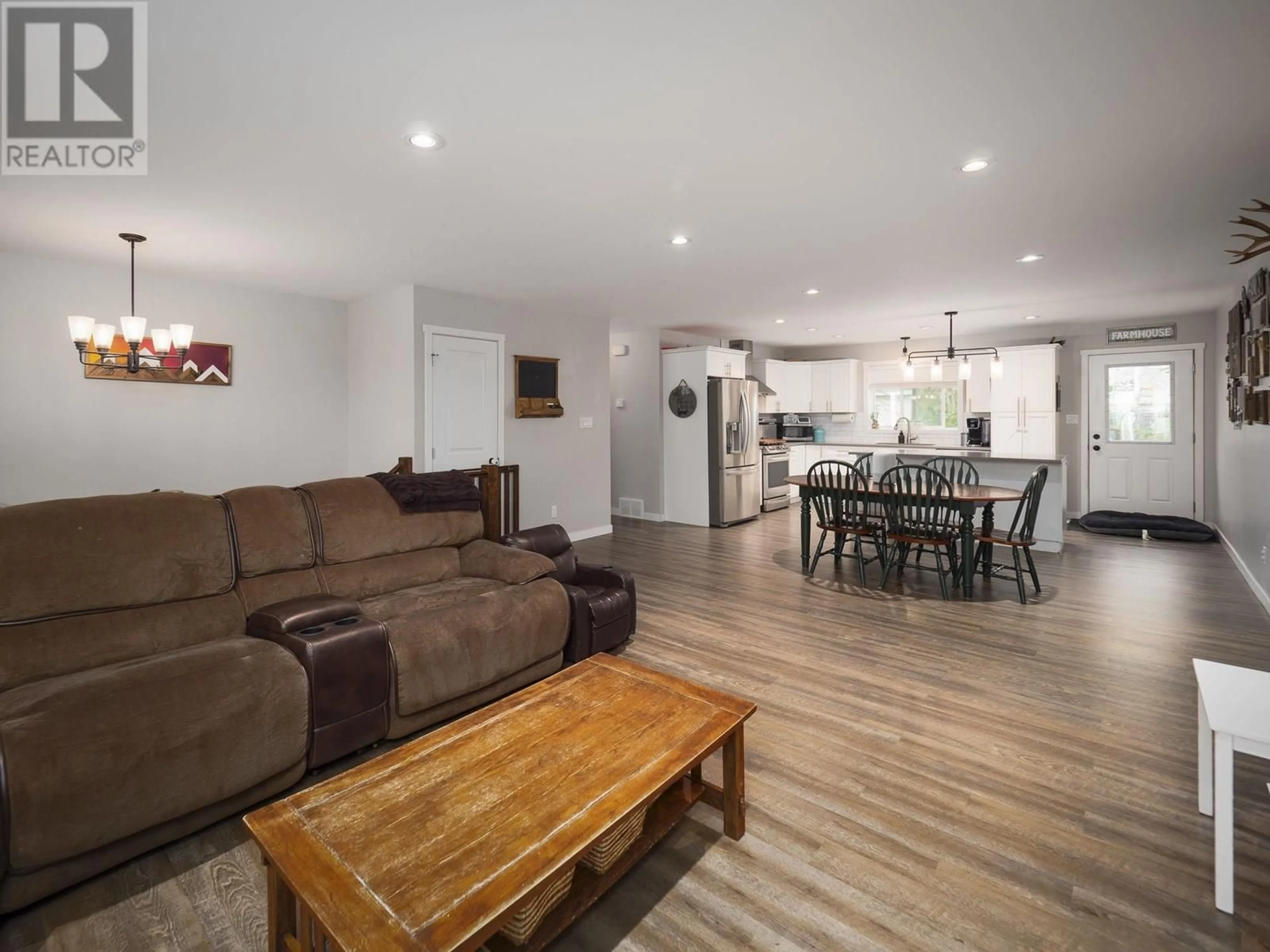 Living room with furniture, wood/laminate floor for 8249 PETER ROAD, Prince George British Columbia V2K0B2