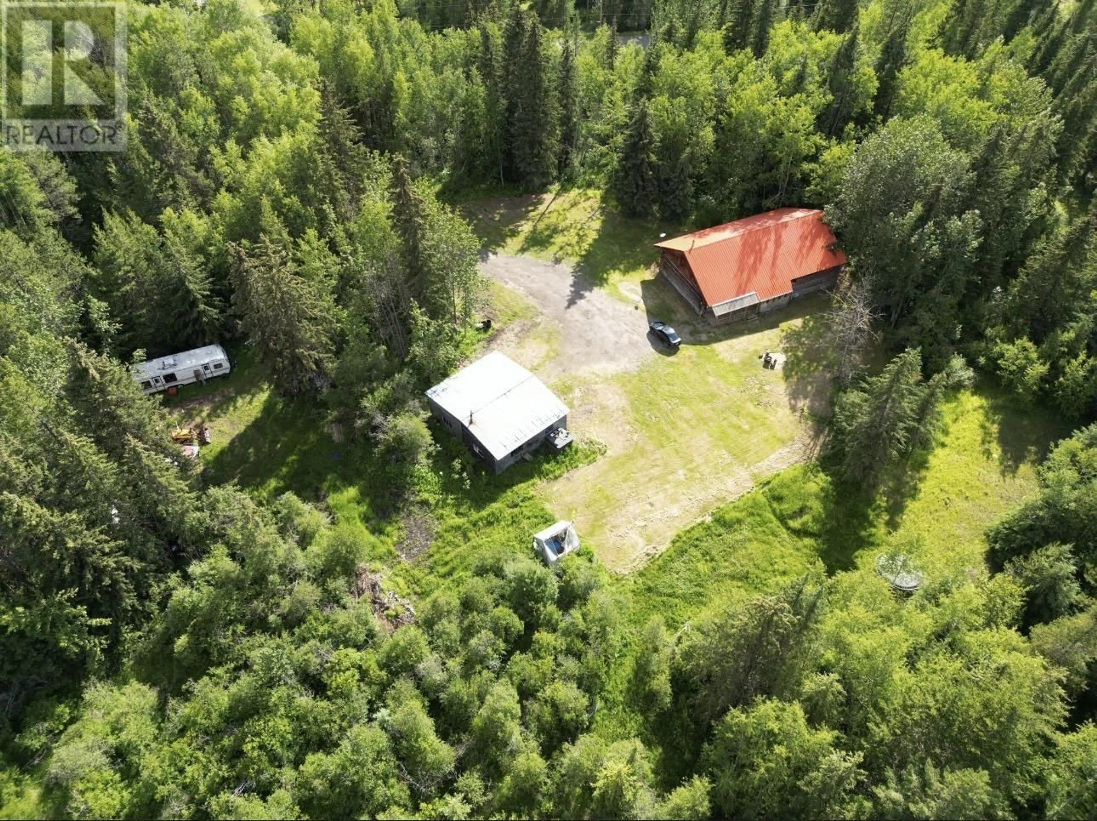A pic from outside/outdoor area/front of a property/back of a property/a pic from drone, forest/trees view for 2828 PIONEER CRESCENT, 150 Mile House British Columbia V0K2G0