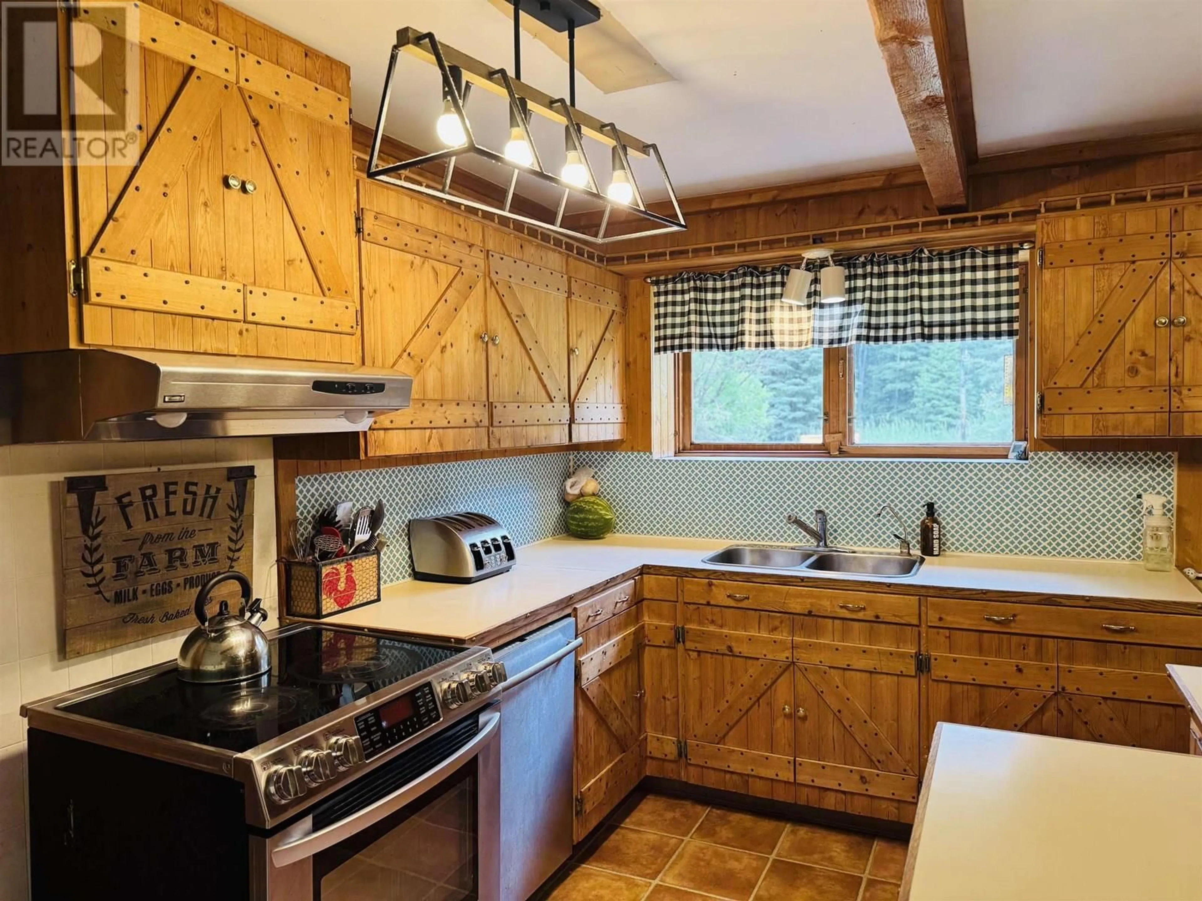 Rustic kitchen, unknown for 2828 PIONEER CRESCENT, 150 Mile House British Columbia V0K2G0