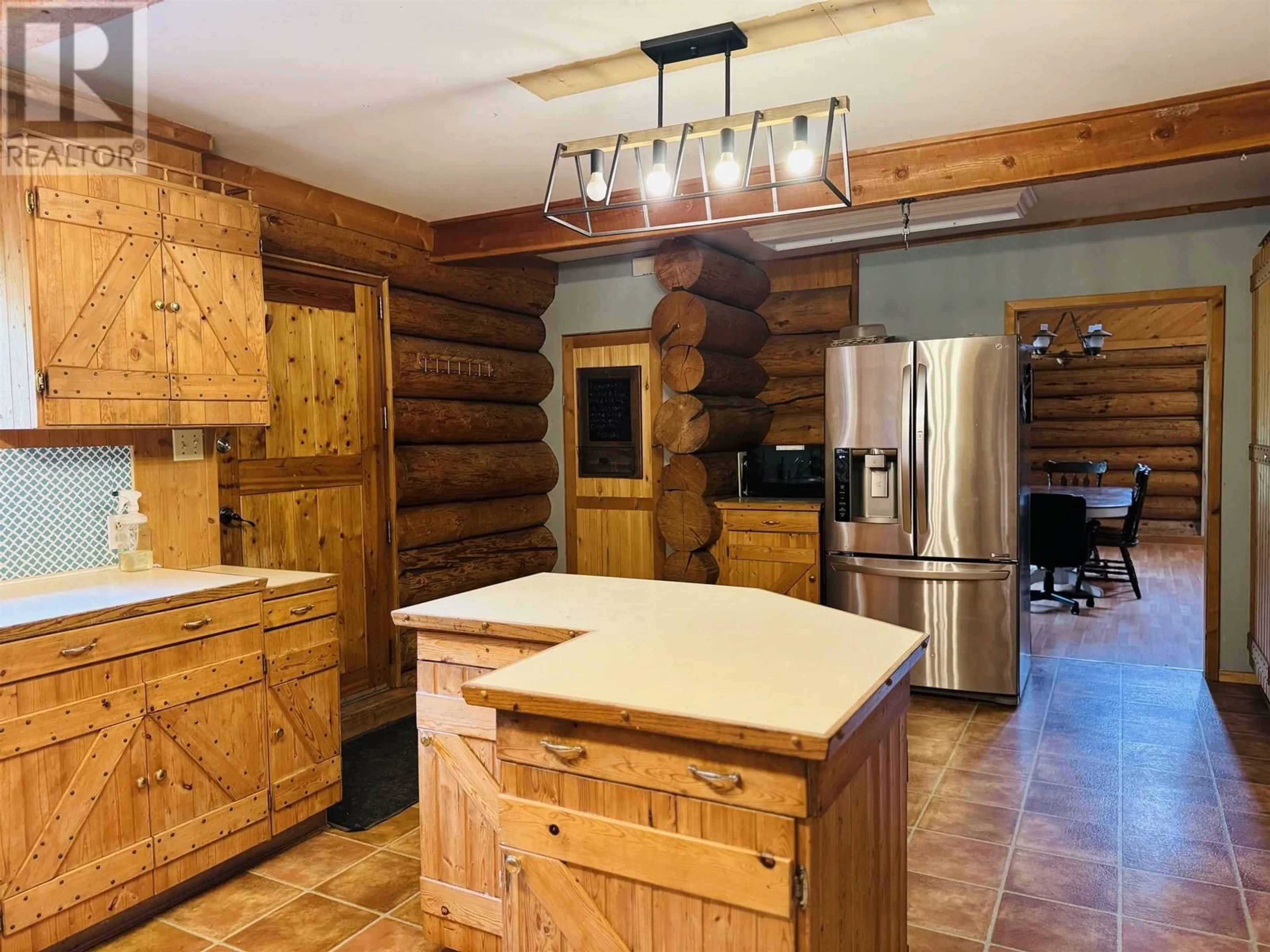 Rustic kitchen, wood/laminate floor for 2828 PIONEER CRESCENT, 150 Mile House British Columbia V0K2G0