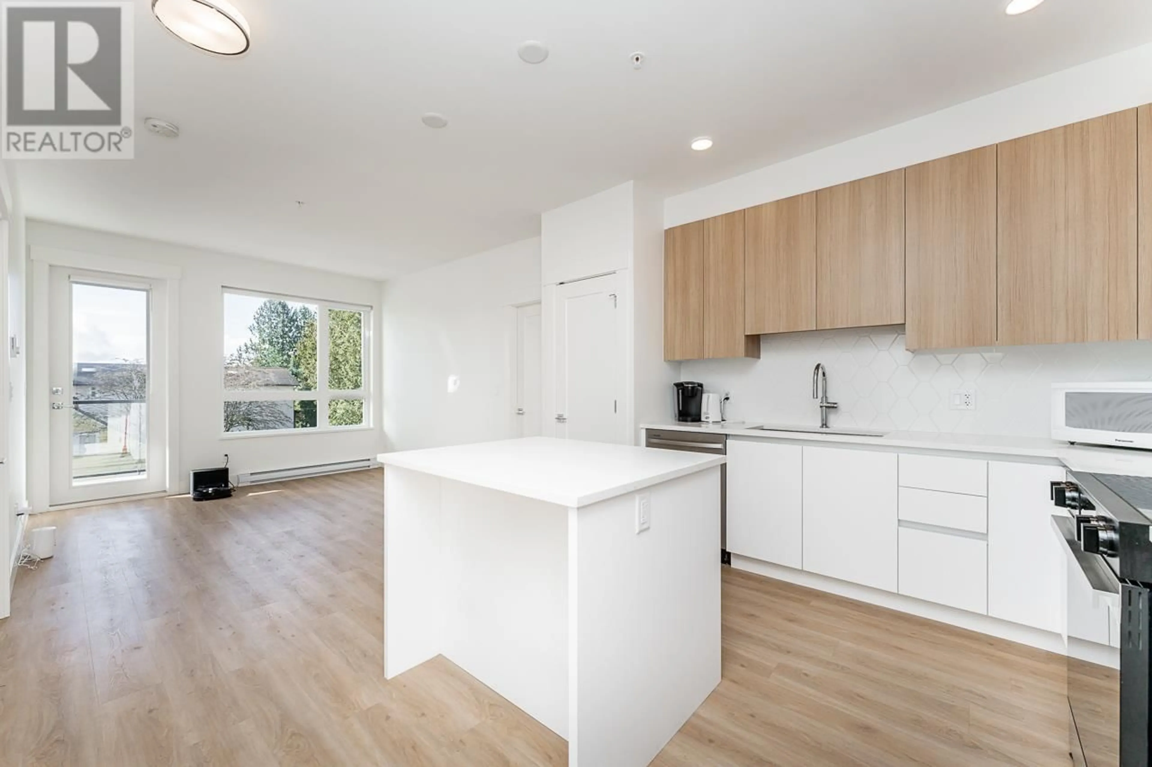 Open concept kitchen, wood/laminate floor for 305 - 11907 223 STREET, Maple Ridge British Columbia V2X4P9