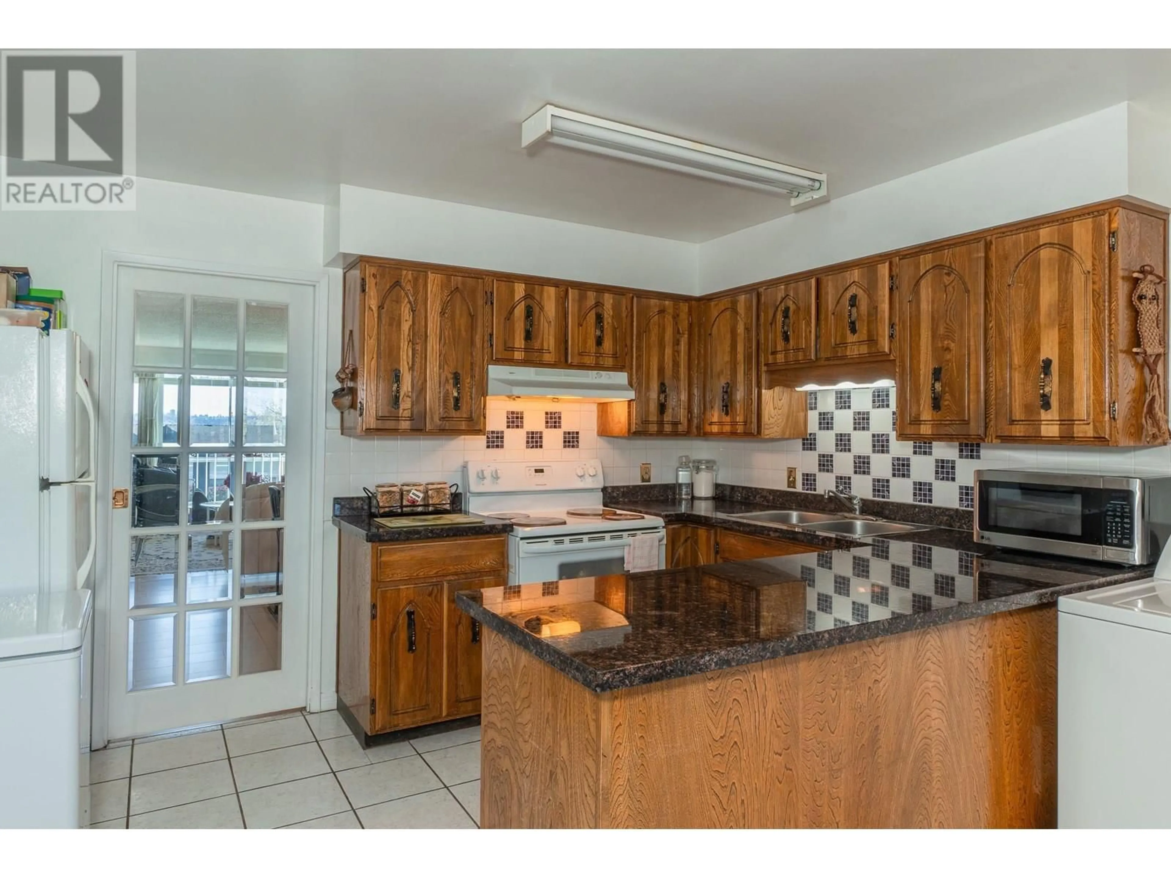 Standard kitchen, ceramic/tile floor for 6675- - 6677 LOCHDALE STREET, Burnaby British Columbia V5B2M7