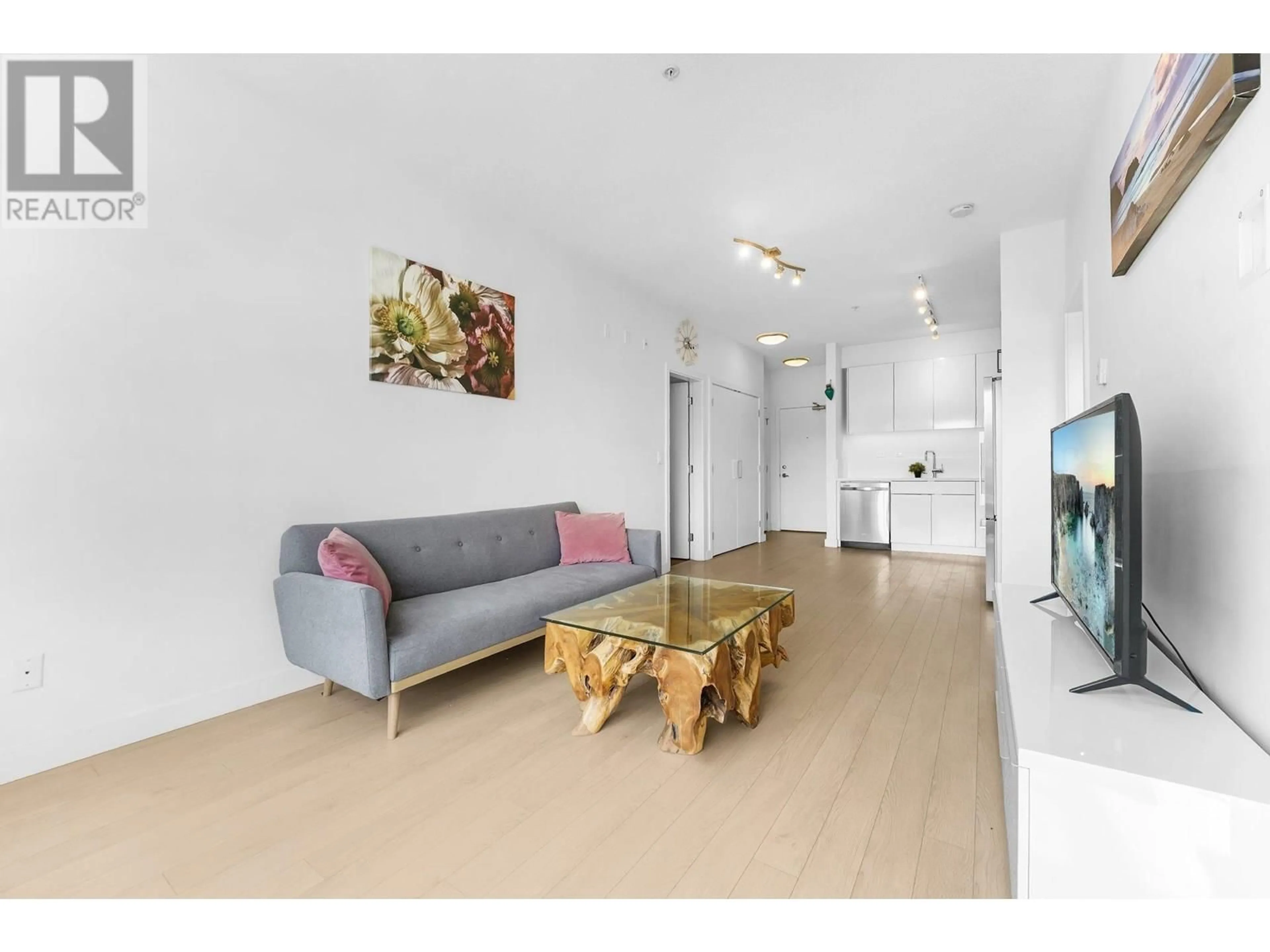 Living room with furniture, unknown for 211 - 1621 HAMILTON AVENUE, North Vancouver British Columbia V7P0B6