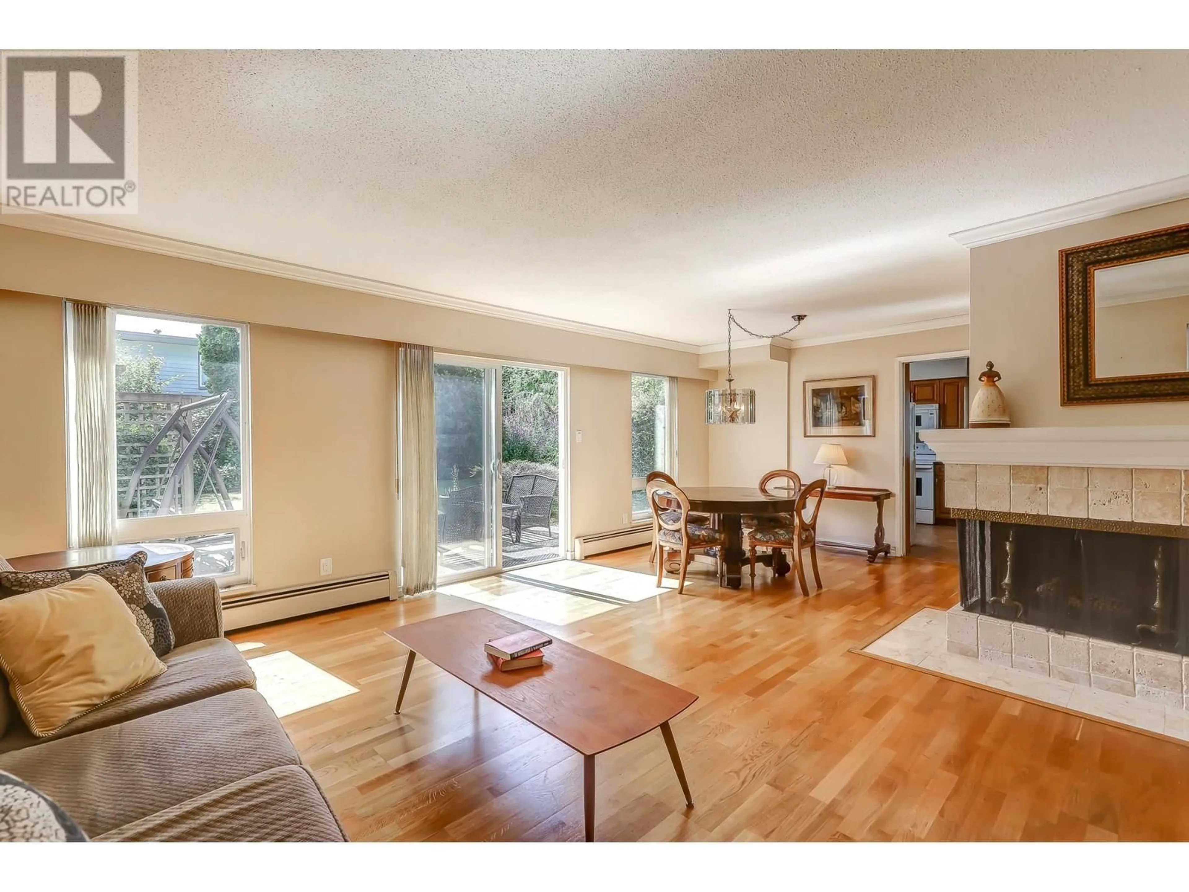 Living room with furniture, wood/laminate floor for 5140 GALWAY DRIVE, Delta British Columbia V4M3R5