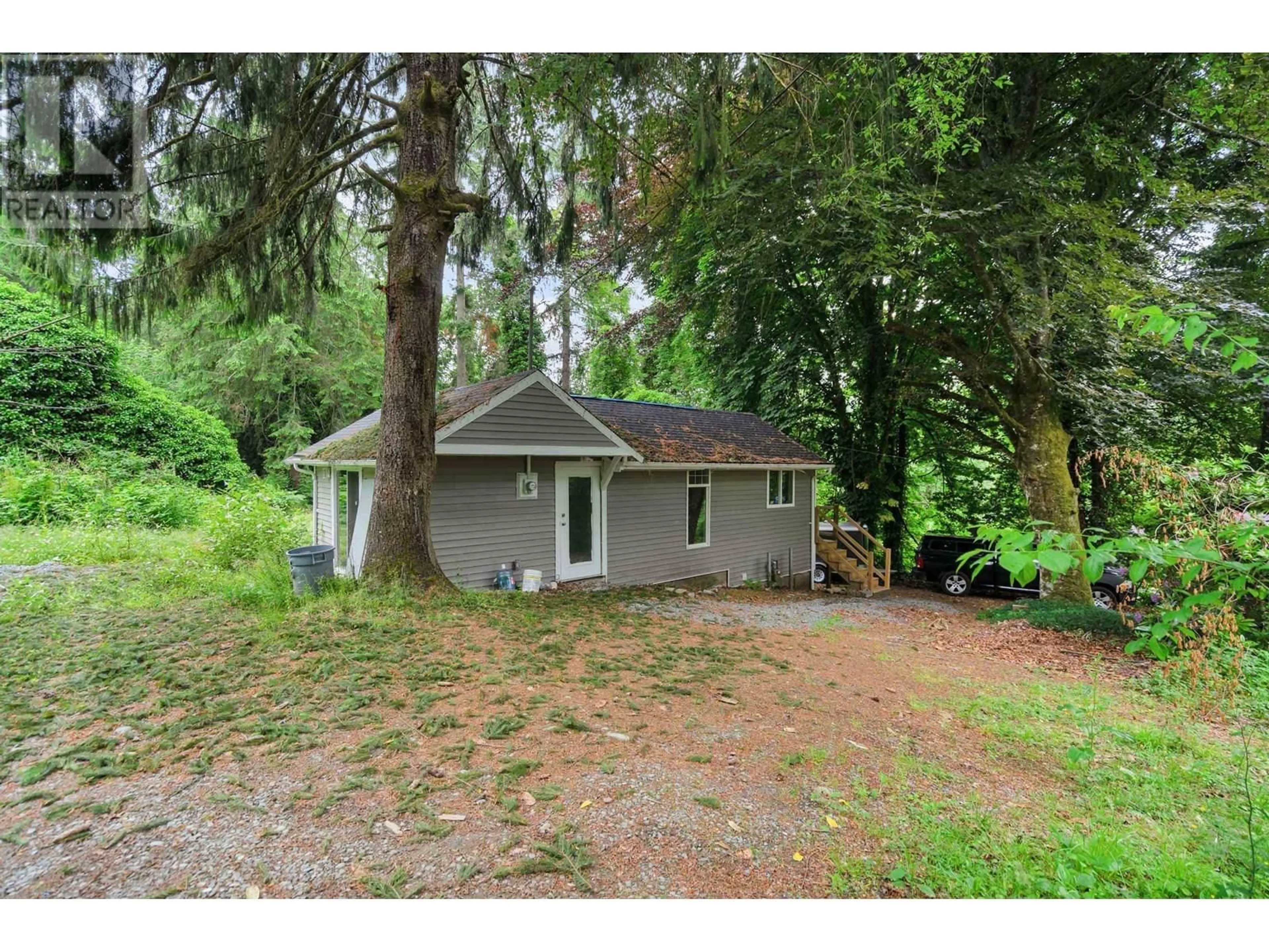 A pic from outside/outdoor area/front of a property/back of a property/a pic from drone, forest/trees view for 24742 100 AVENUE, Maple Ridge British Columbia V2W1J8