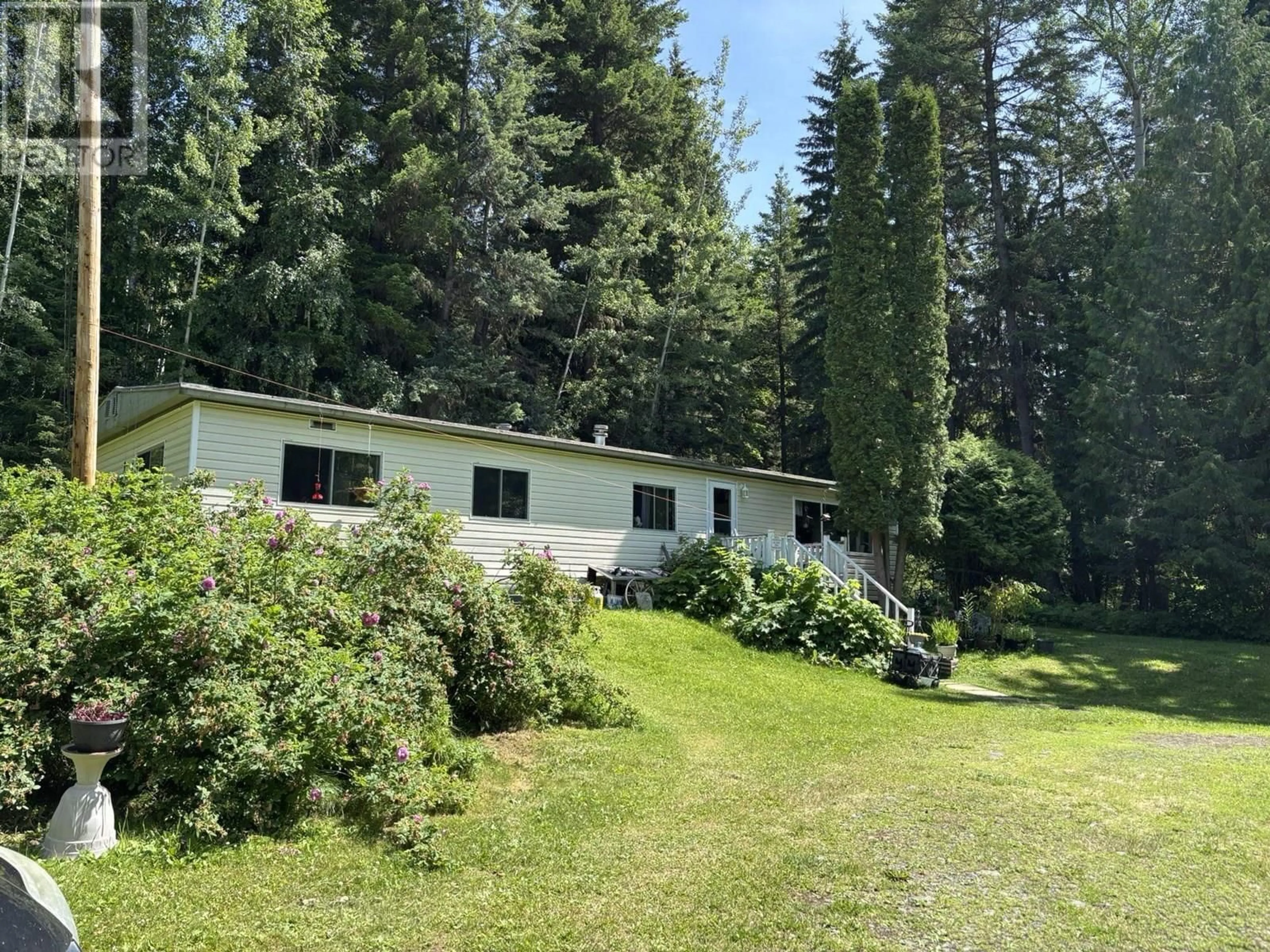 A pic from outside/outdoor area/front of a property/back of a property/a pic from drone, forest/trees view for 3936 FANSLAU ROAD, Quesnel British Columbia V2J6V7