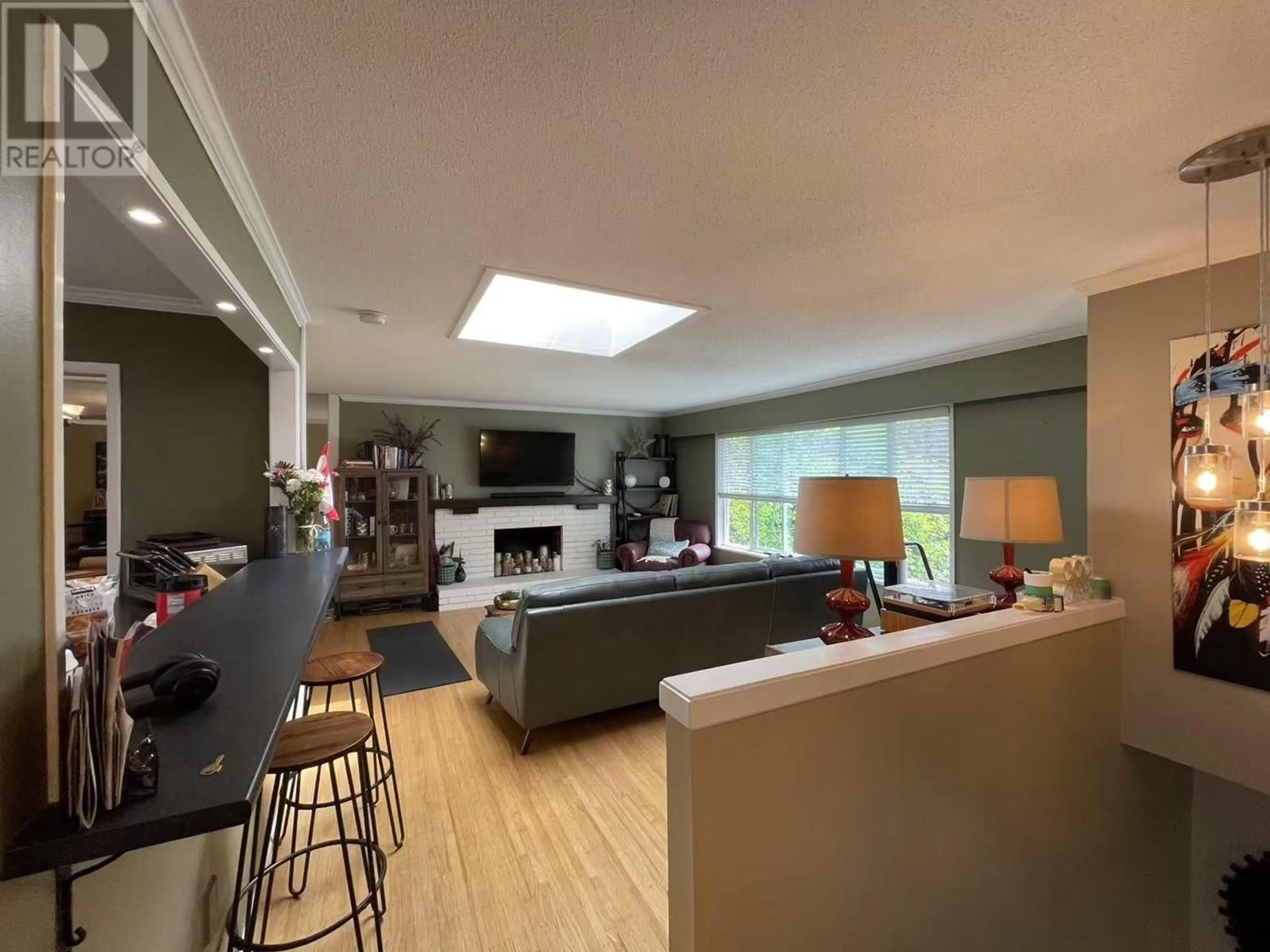 Living room with furniture, wood/laminate floor for 5105 8A AVENUE, Delta British Columbia V4M1T5