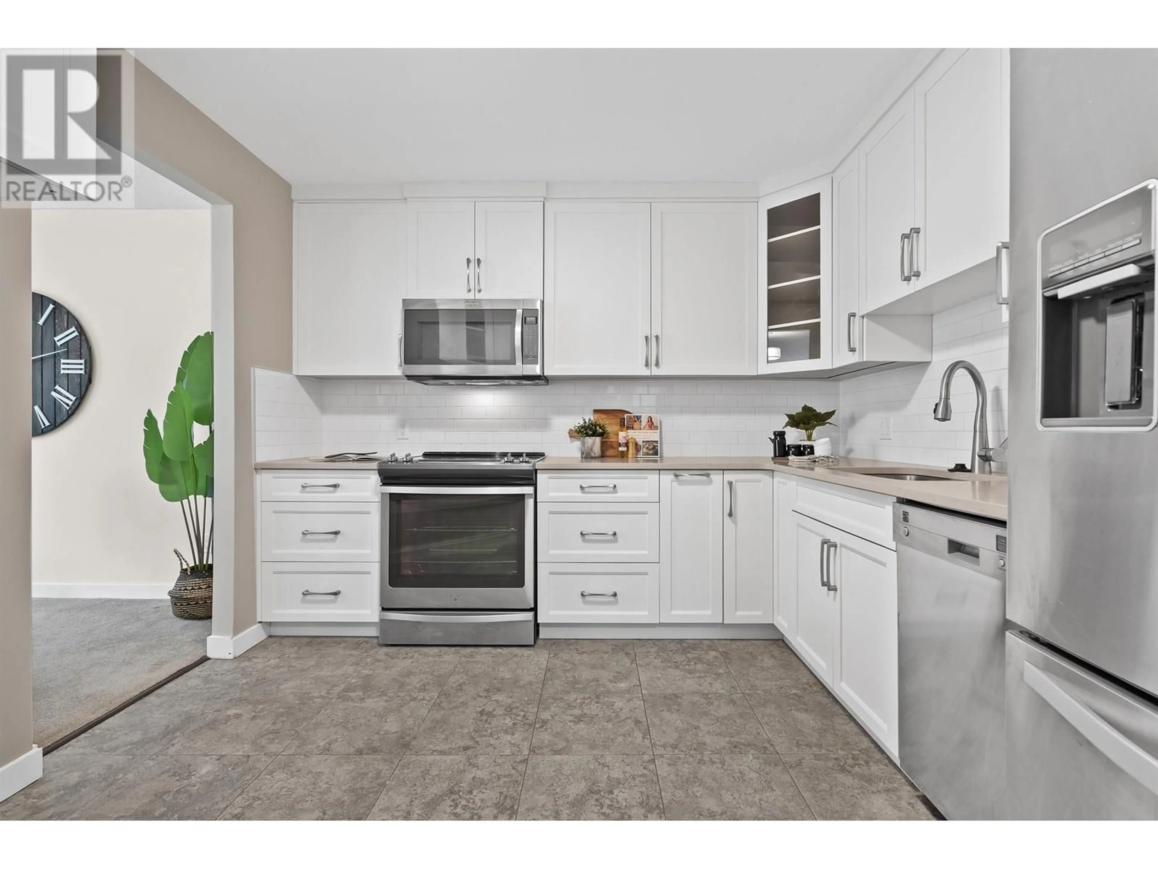 Open concept kitchen, ceramic/tile floor for 408 - 518 MOBERLY ROAD, Vancouver British Columbia V5Z4G3