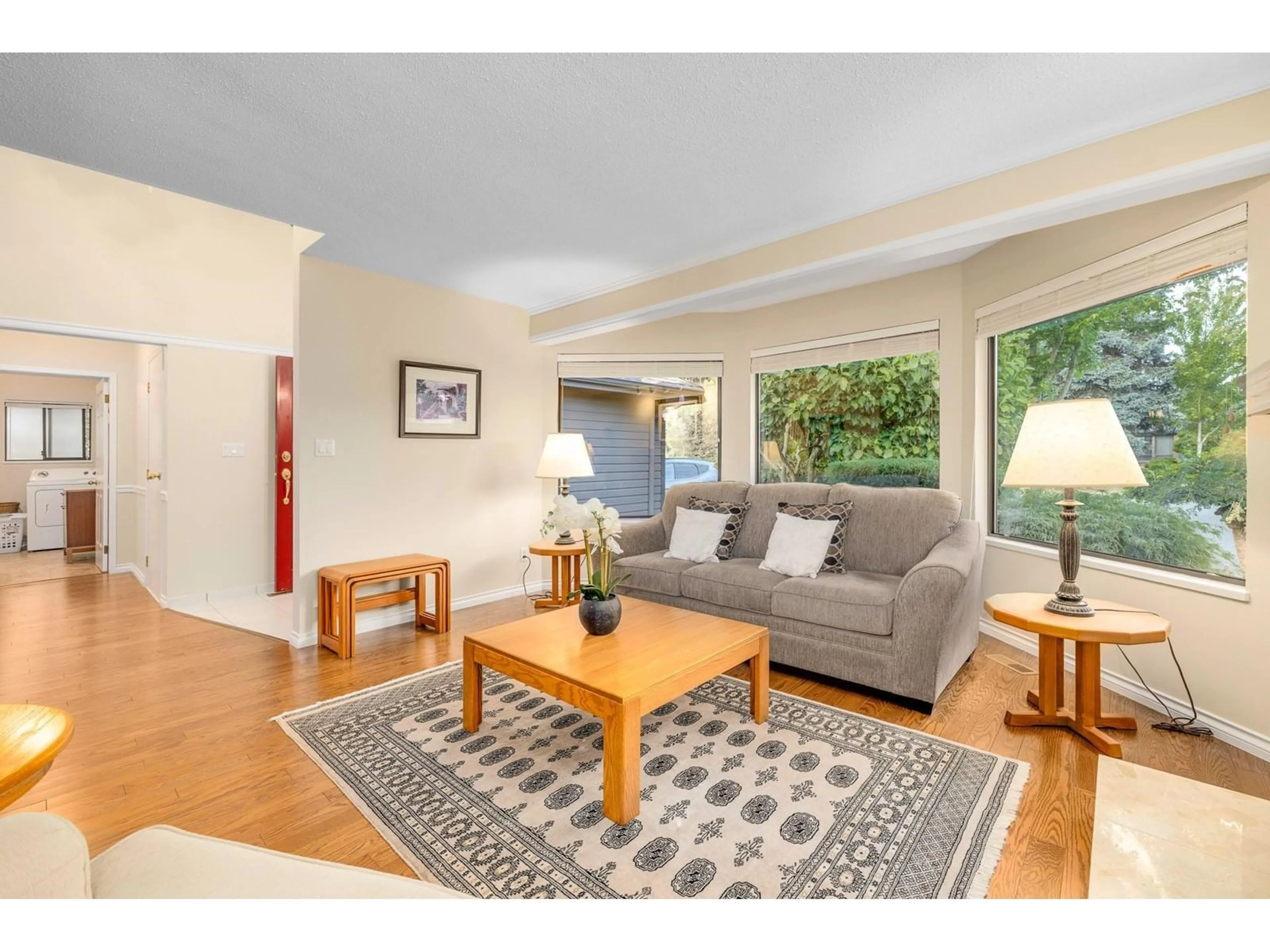 Living room with furniture, wood/laminate floor for 1923 141A, Surrey British Columbia V4A7R4