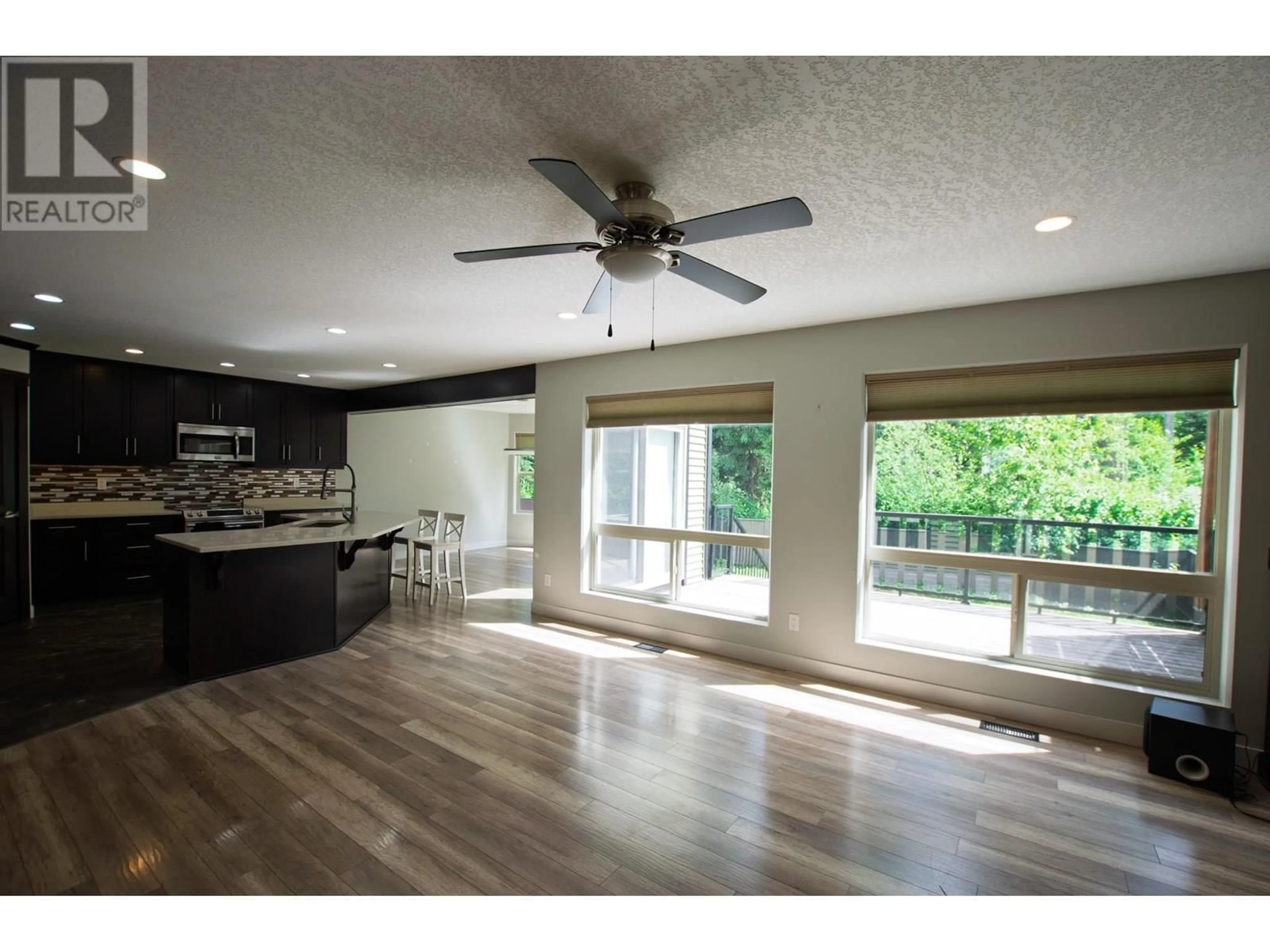 Open concept kitchen, wood/laminate floor for 8089 STILLWATER CRESCENT, Prince George British Columbia V2N0C2