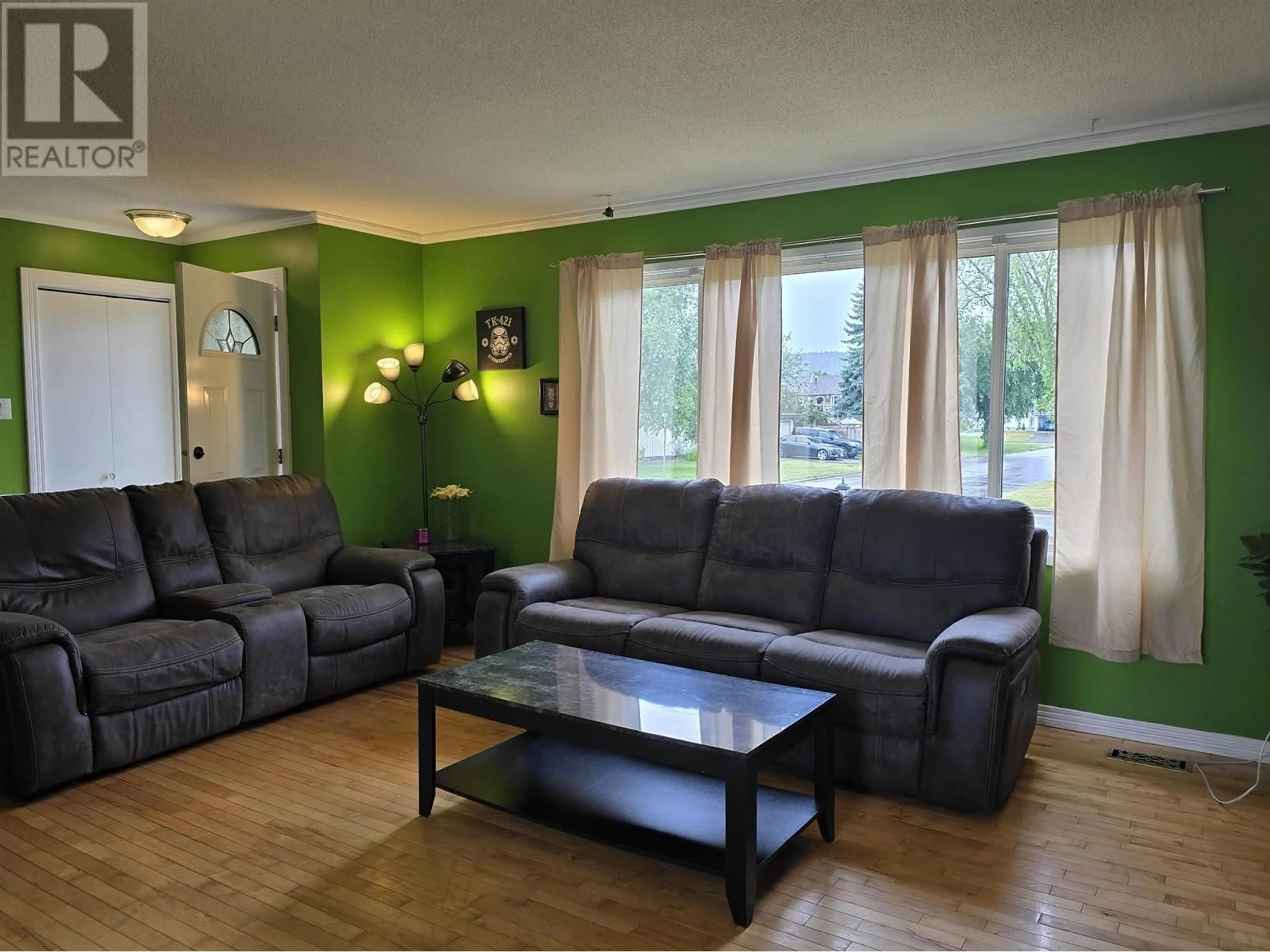 Living room with furniture, wood/laminate floor for 402 QUINN STREET, Prince George British Columbia V2M3J5