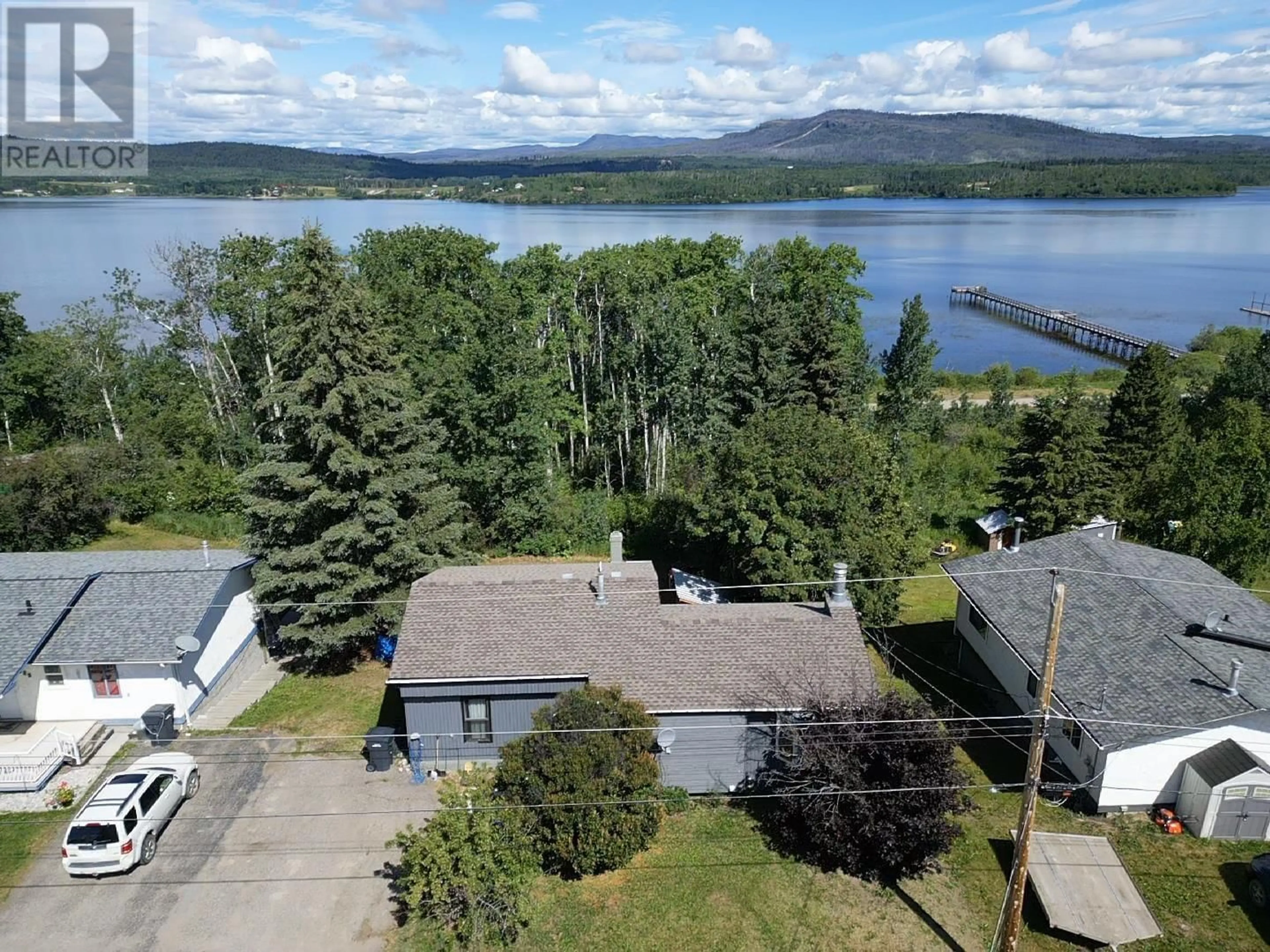 A pic from outside/outdoor area/front of a property/back of a property/a pic from drone, water/lake/river/ocean view for 137 TUNASA CRESCENT, Fraser Lake British Columbia V0J1S0