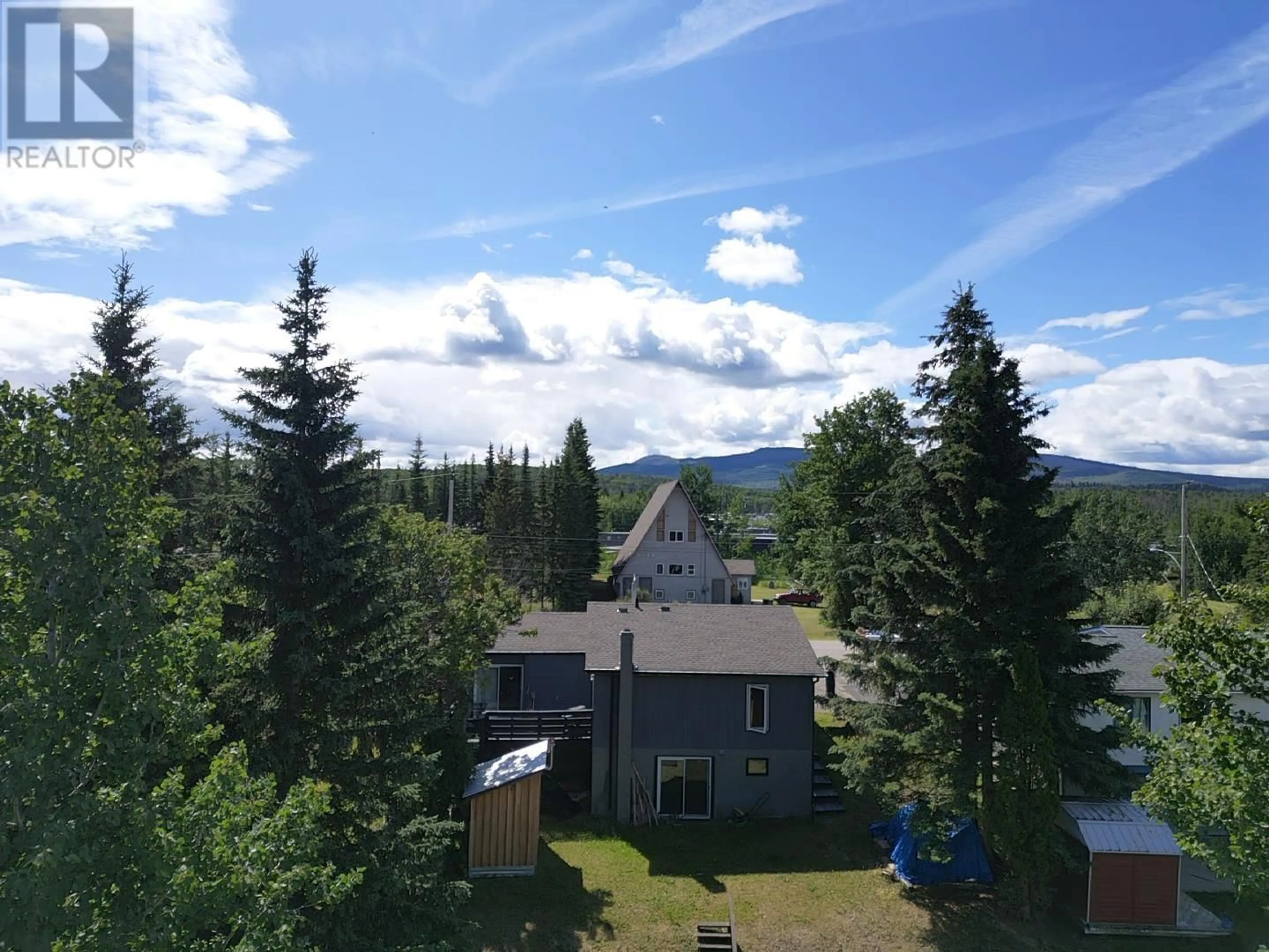 A pic from outside/outdoor area/front of a property/back of a property/a pic from drone, mountain view for 137 TUNASA CRESCENT, Fraser Lake British Columbia V0J1S0