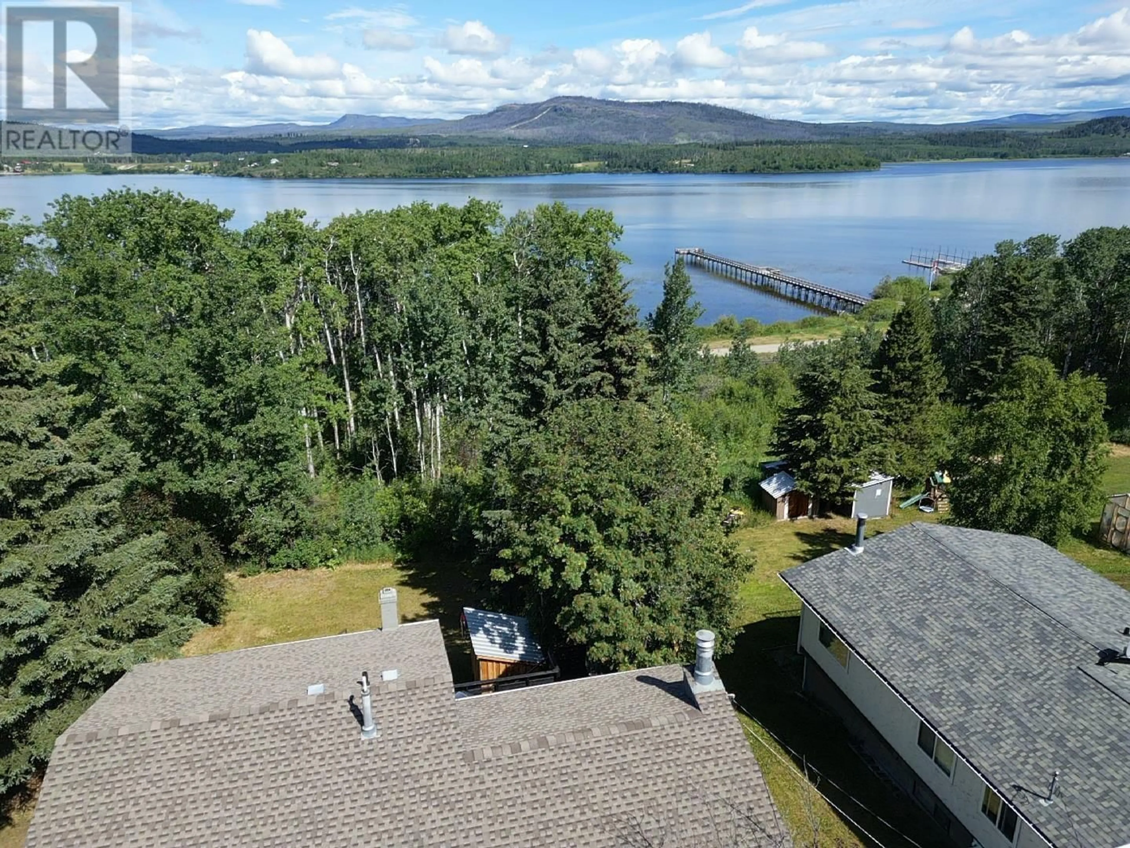 A pic from outside/outdoor area/front of a property/back of a property/a pic from drone, water/lake/river/ocean view for 137 TUNASA CRESCENT, Fraser Lake British Columbia V0J1S0