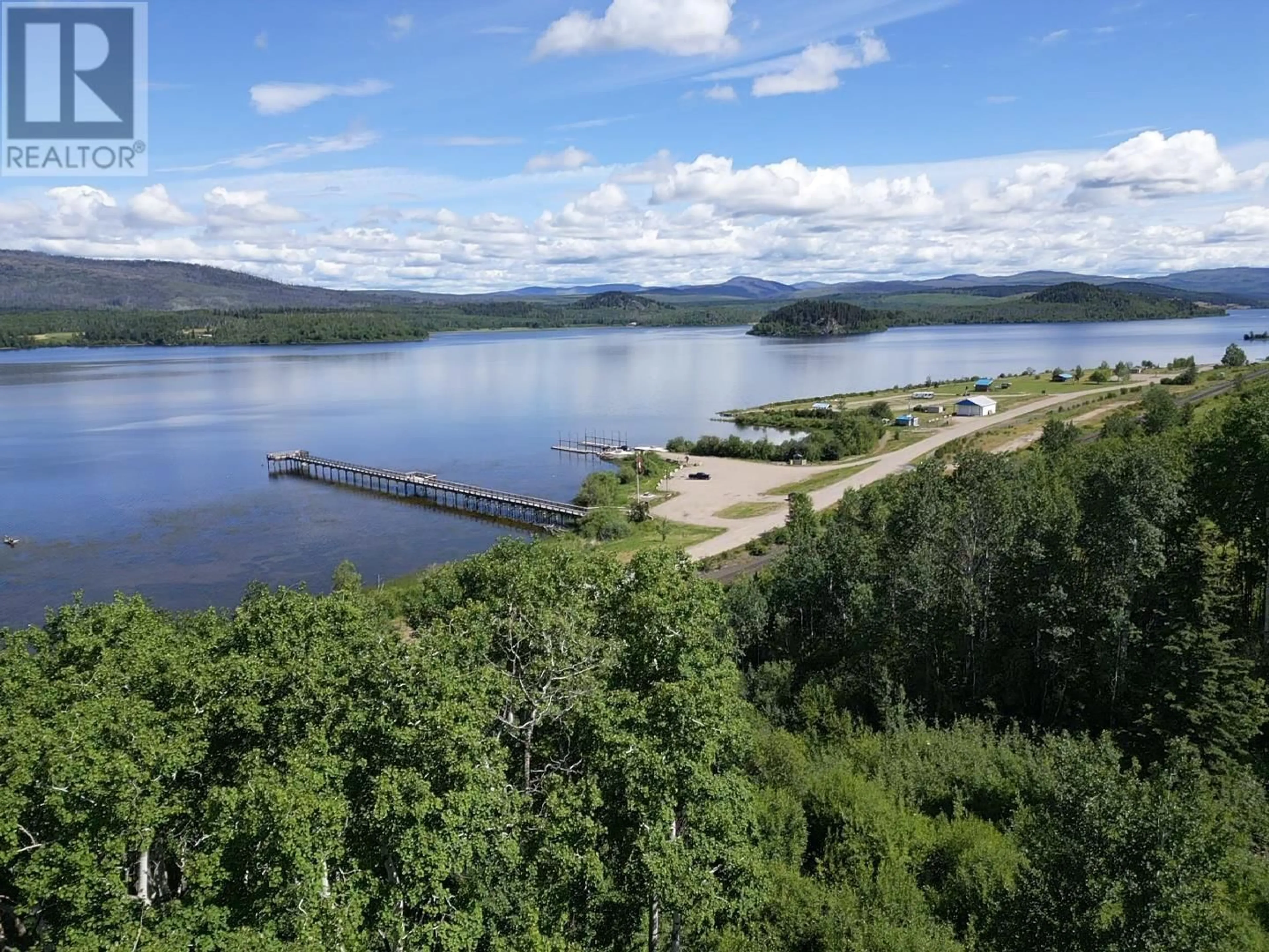 A pic from outside/outdoor area/front of a property/back of a property/a pic from drone, water/lake/river/ocean view for 137 TUNASA CRESCENT, Fraser Lake British Columbia V0J1S0