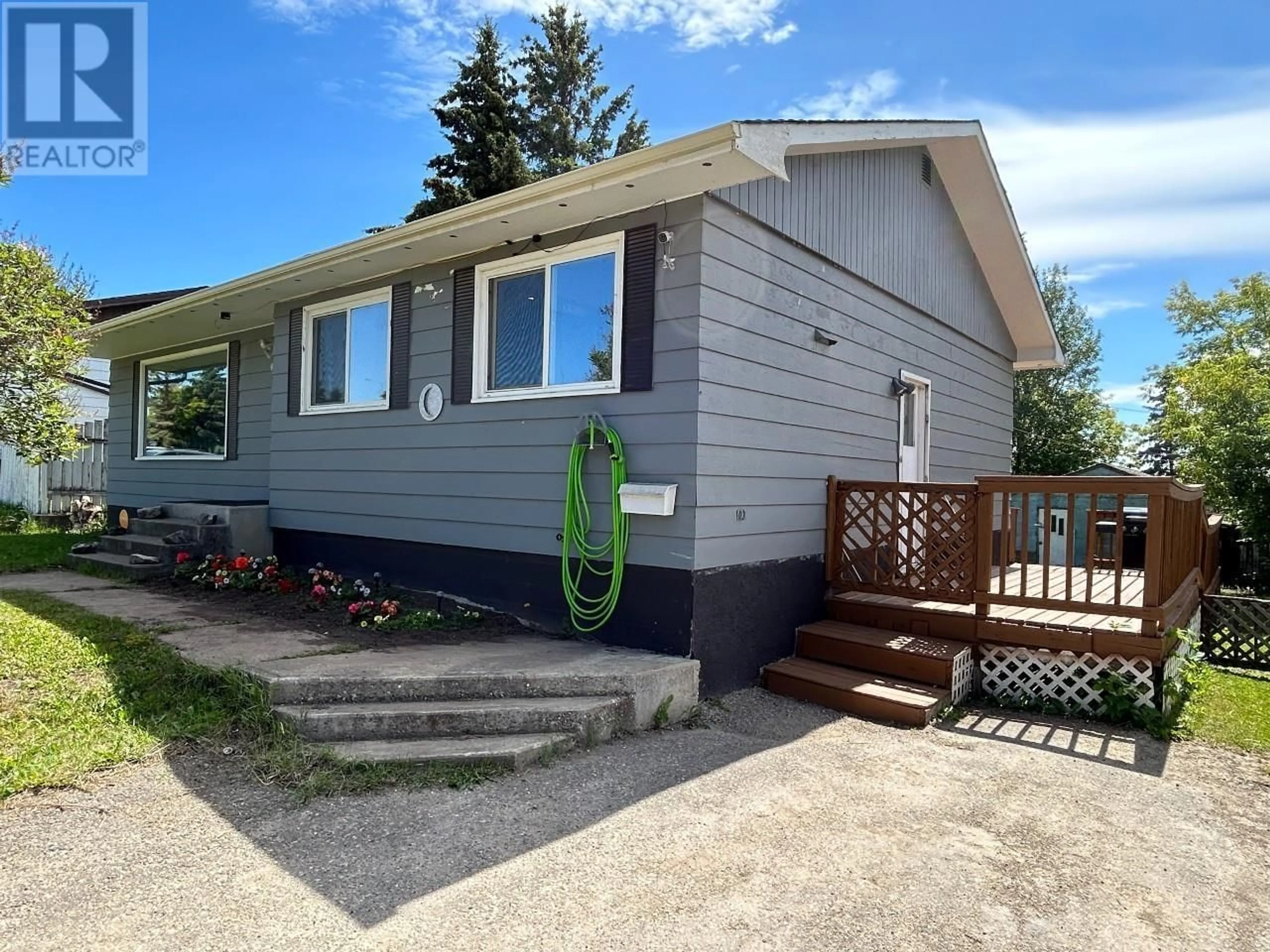 Home with vinyl exterior material, street for 9311 98A AVENUE, Fort St. John British Columbia V1J1R2