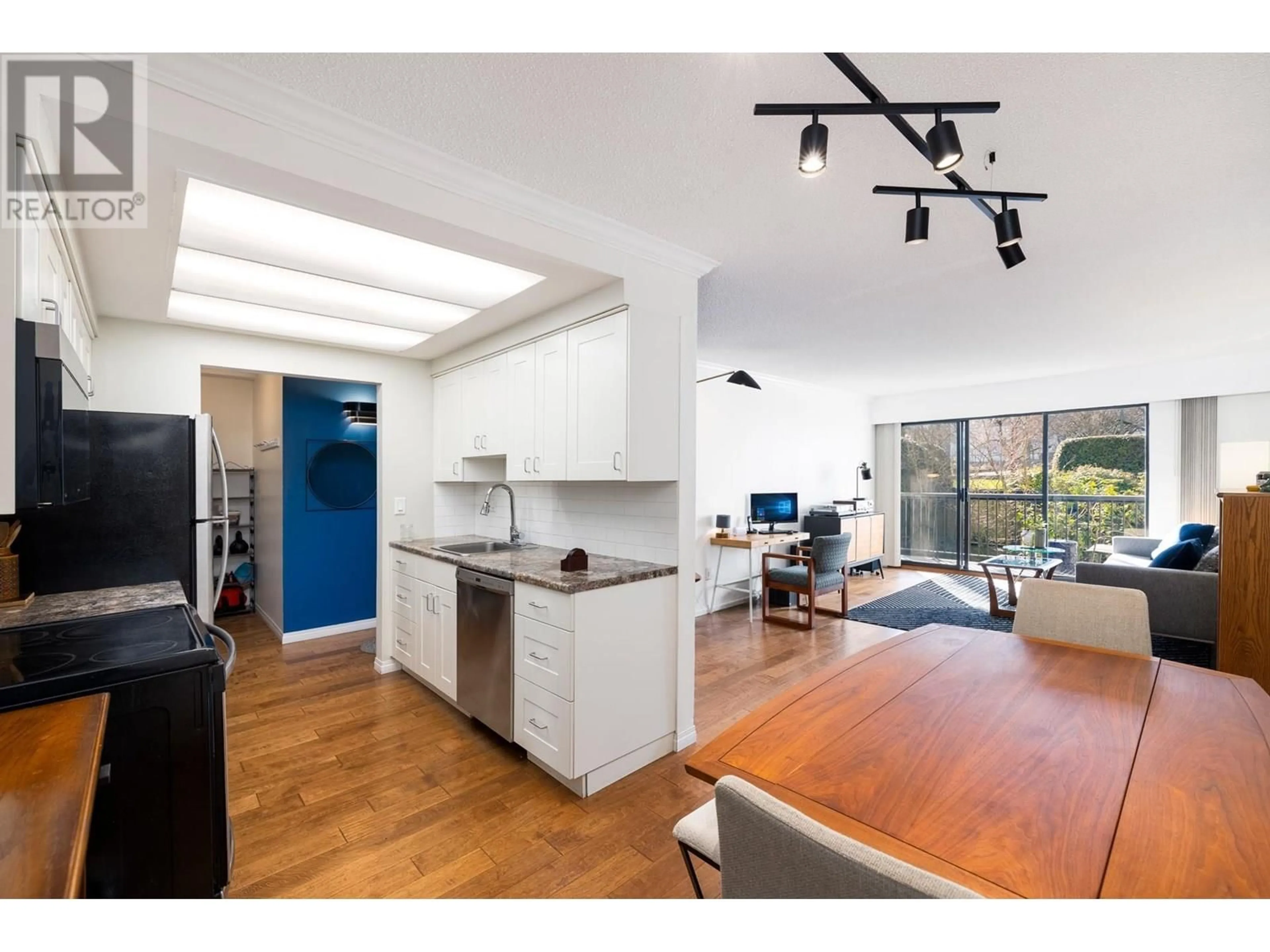 Open concept kitchen, wood/laminate floor for 207 - 444 6TH AVENUE, Vancouver British Columbia V5T1K6
