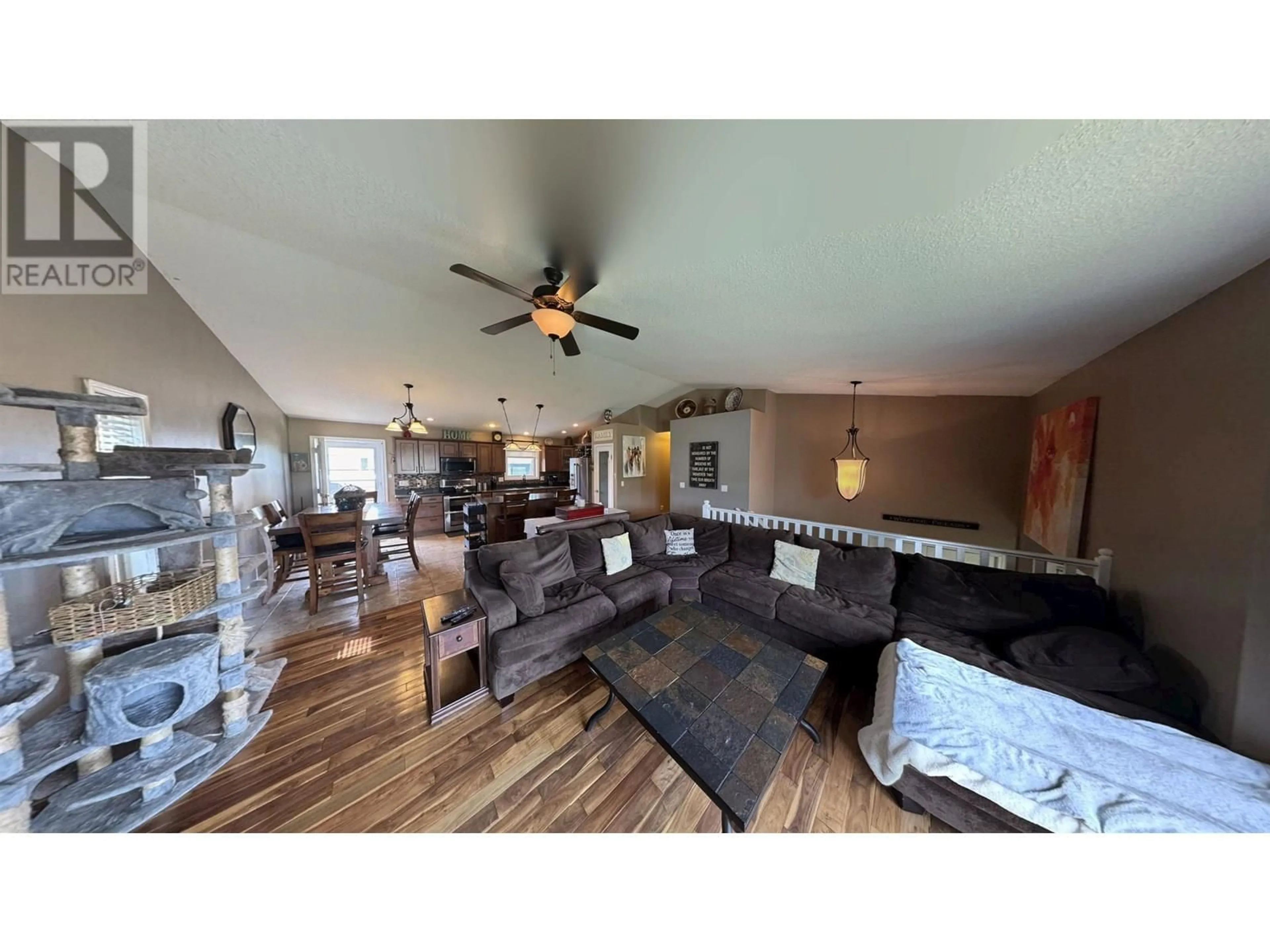 Living room with furniture, wood/laminate floor for 11408 102 STREET, Fort St. John British Columbia V1J7J2