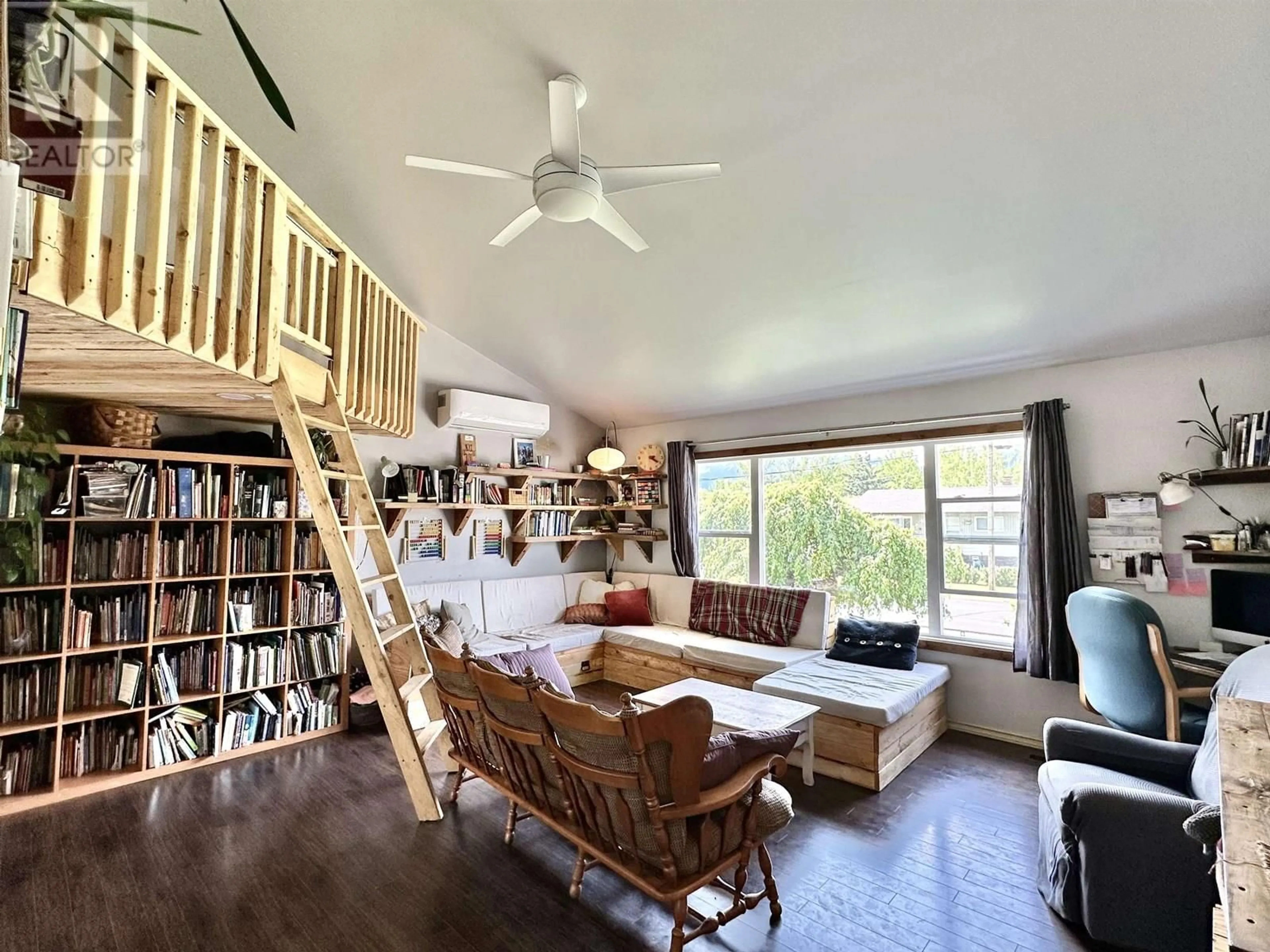 Living room with furniture, wood/laminate floor for 765 DOMINION STREET, McBride British Columbia V0J2E0