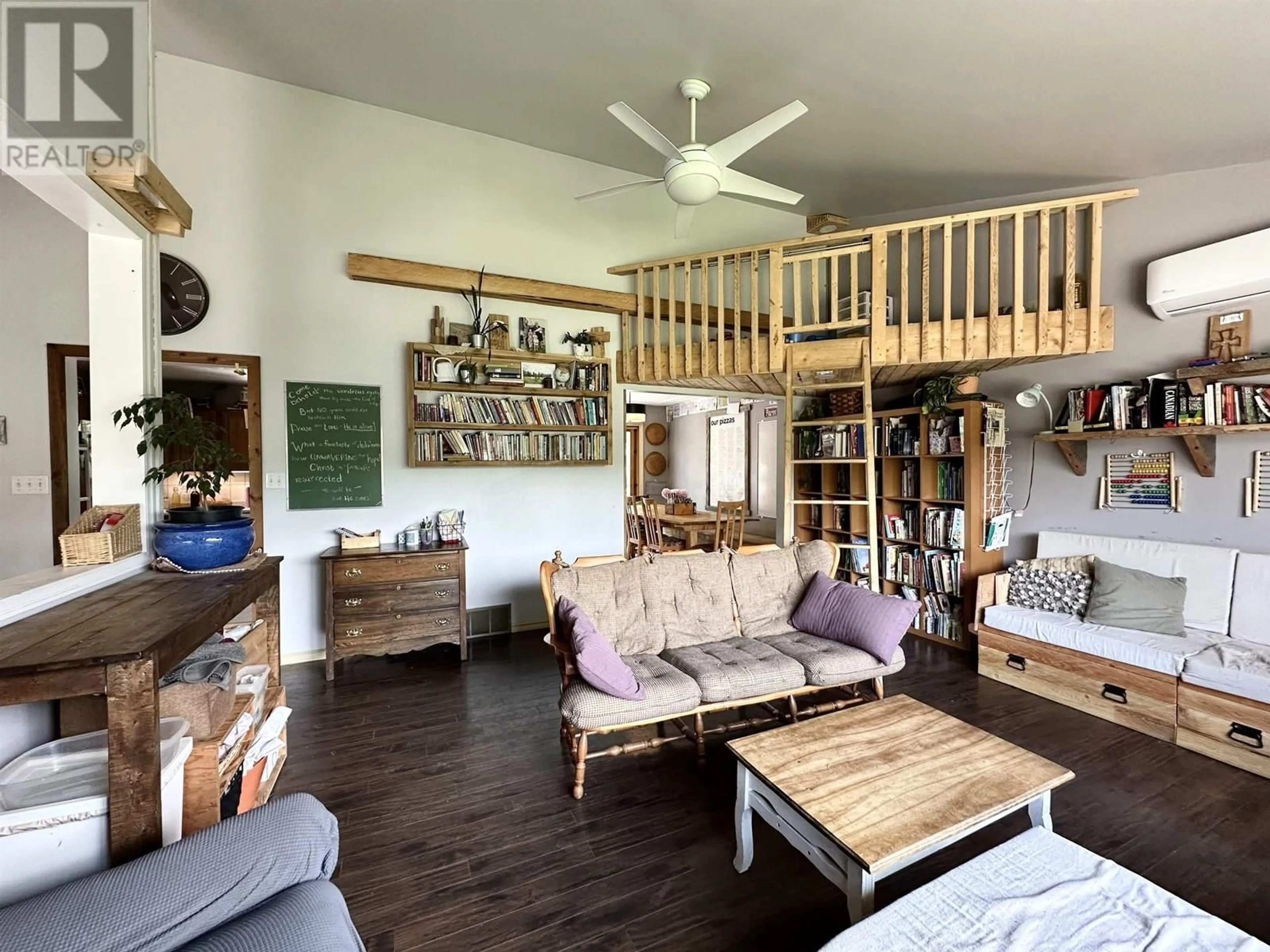Living room with furniture, wood/laminate floor for 765 DOMINION STREET, McBride British Columbia V0J2E0