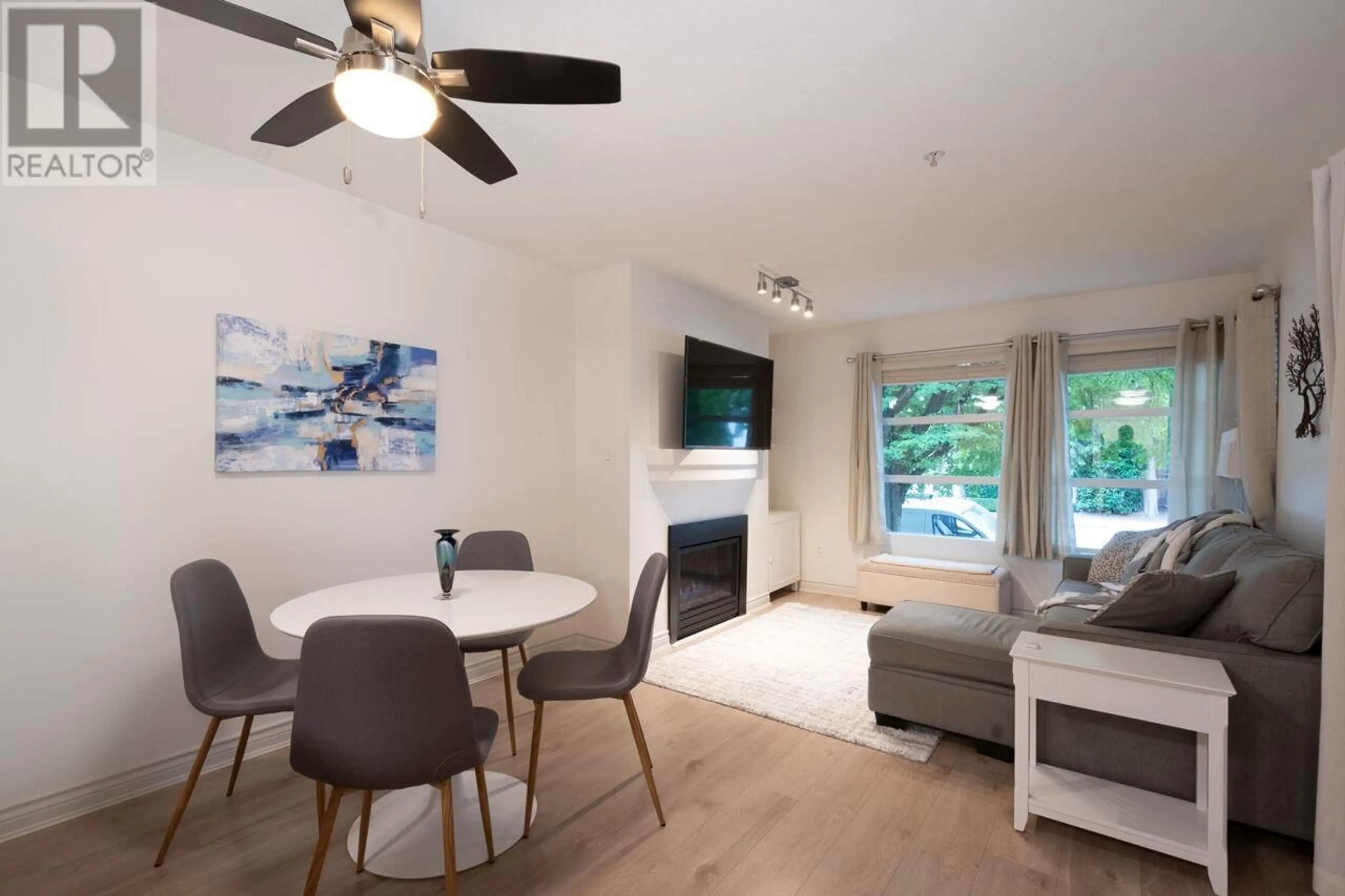 Living room with furniture, wood/laminate floor for 206 - 3083 4TH AVENUE, Vancouver British Columbia V6K1R5