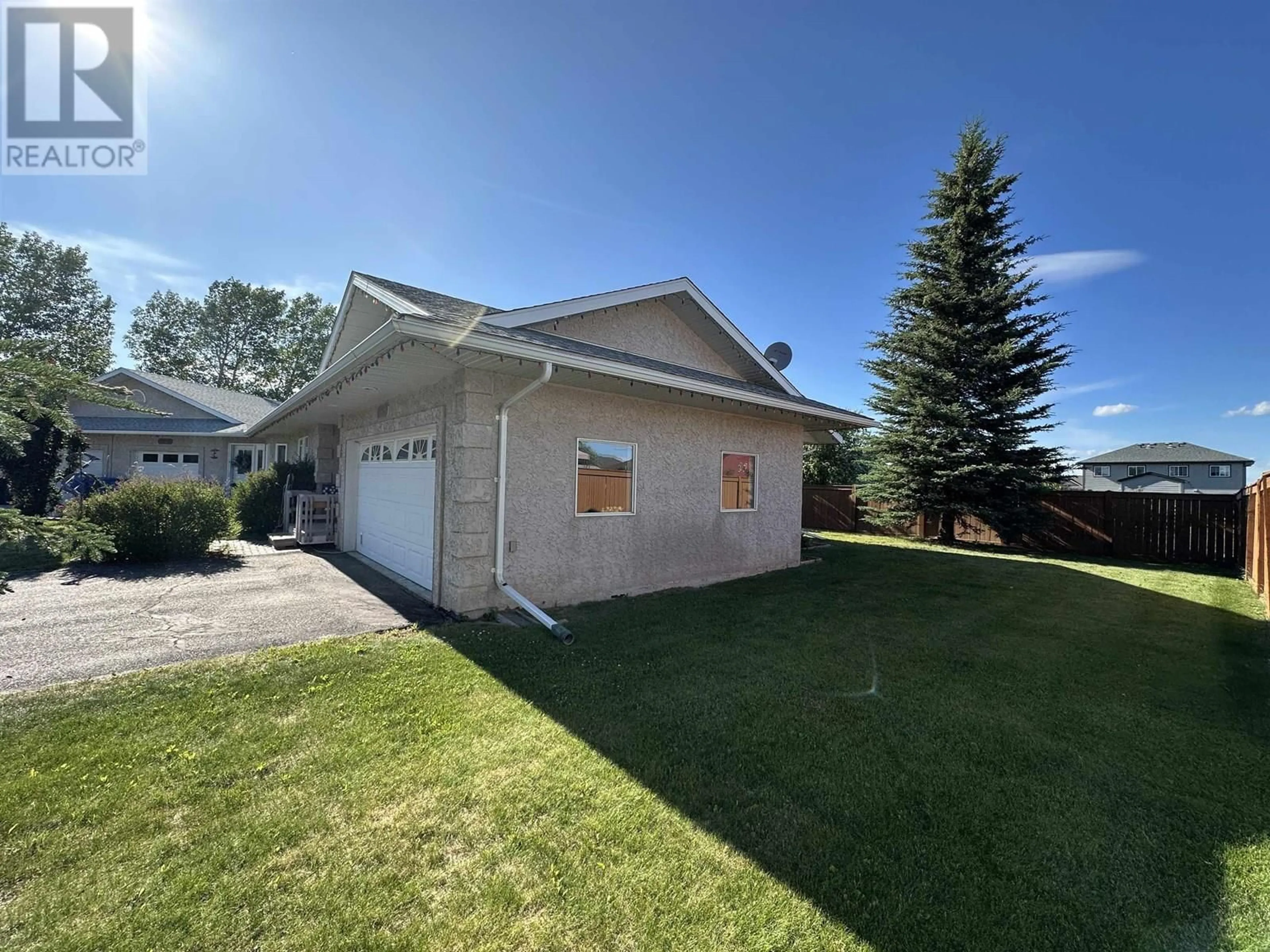 Home with vinyl exterior material, street for 9916 115 AVENUE, Fort St. John British Columbia V1J6R8