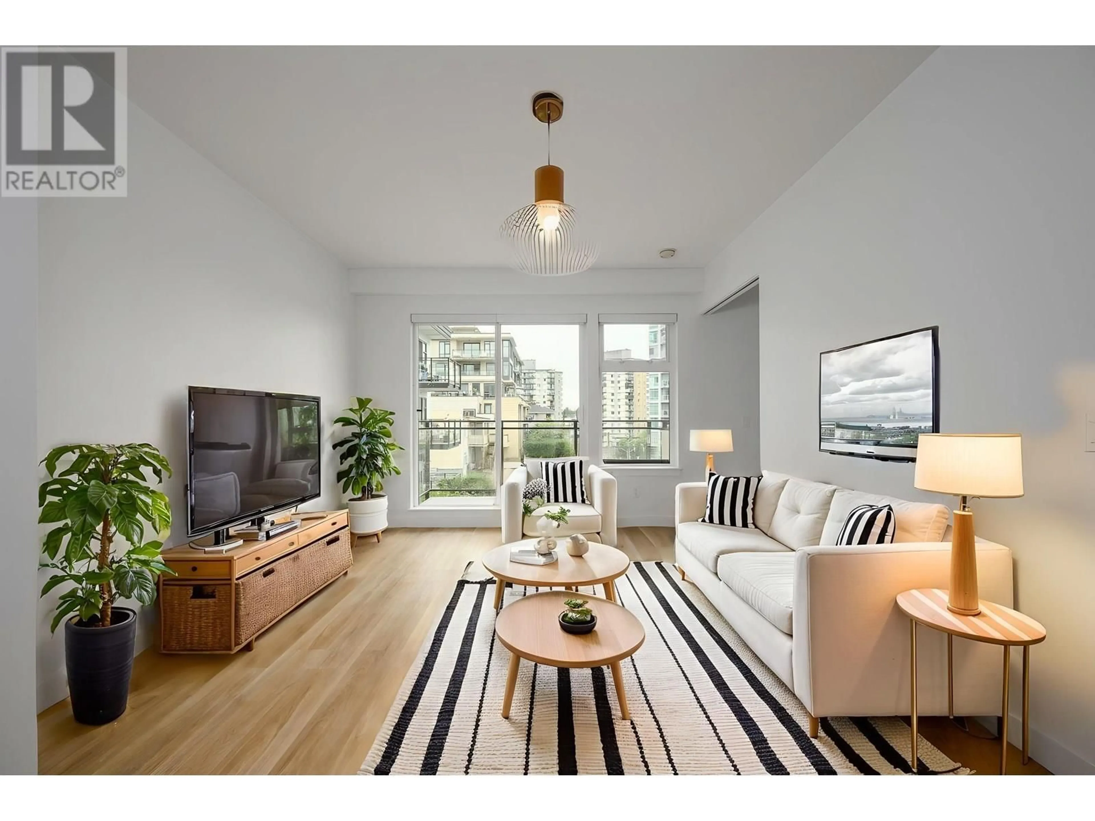 Living room with furniture, wood/laminate floor for 414 - 111 3RD STREET, North Vancouver British Columbia V7L0C6
