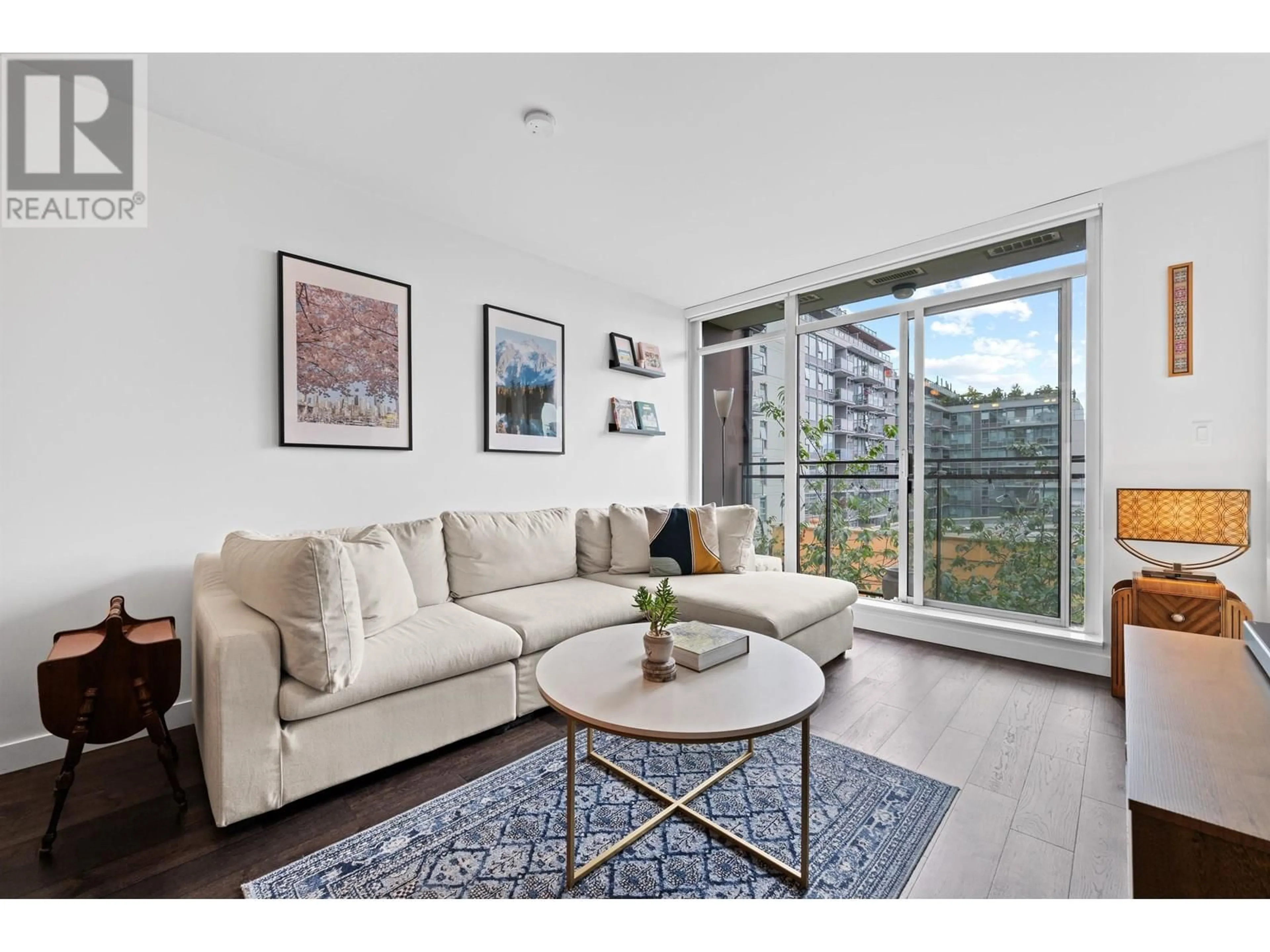 Living room with furniture, wood/laminate floor for 309 - 2321 SCOTIA STREET, Vancouver British Columbia V5T0A8