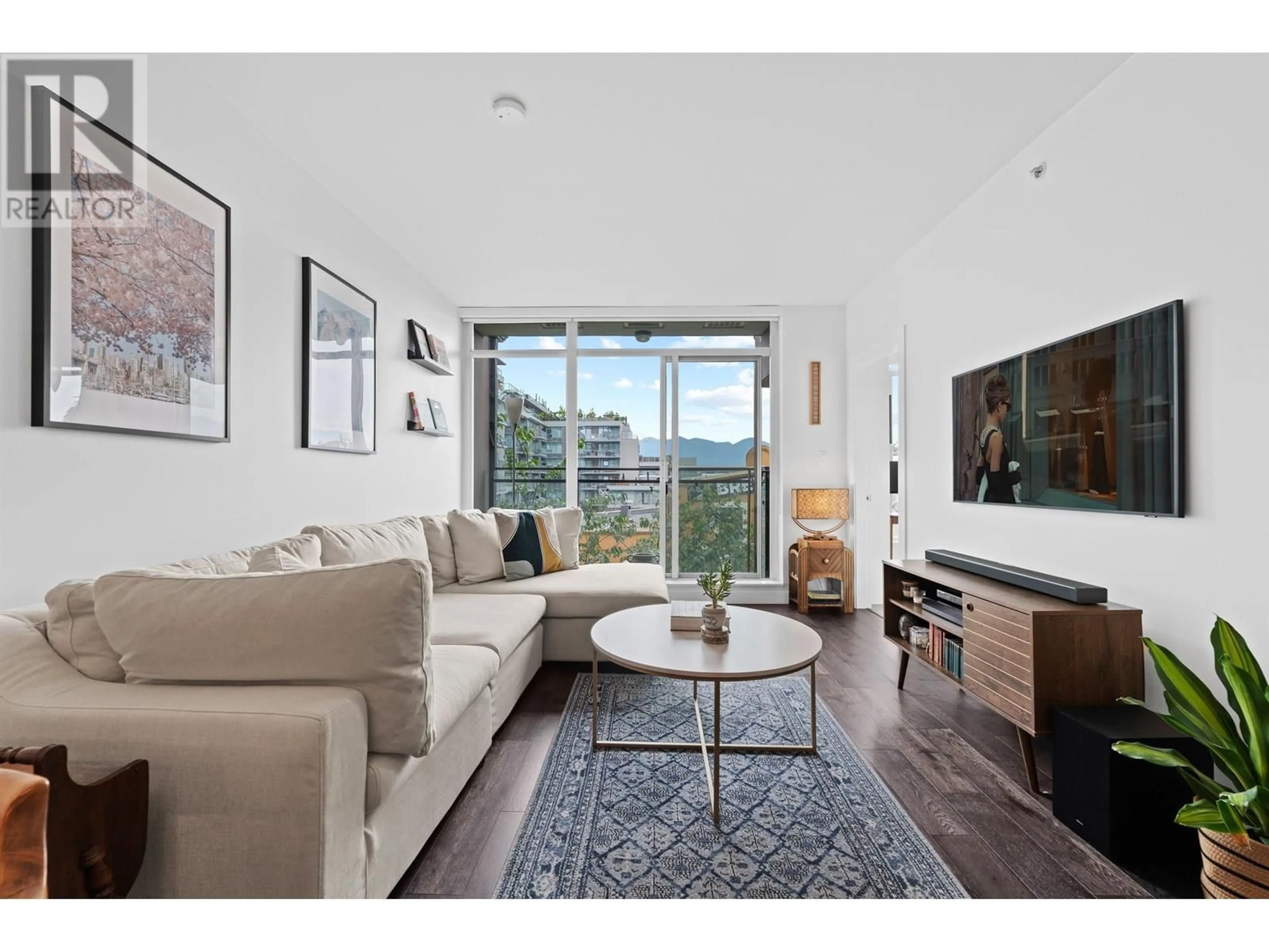 Living room with furniture, wood/laminate floor for 309 - 2321 SCOTIA STREET, Vancouver British Columbia V5T0A8