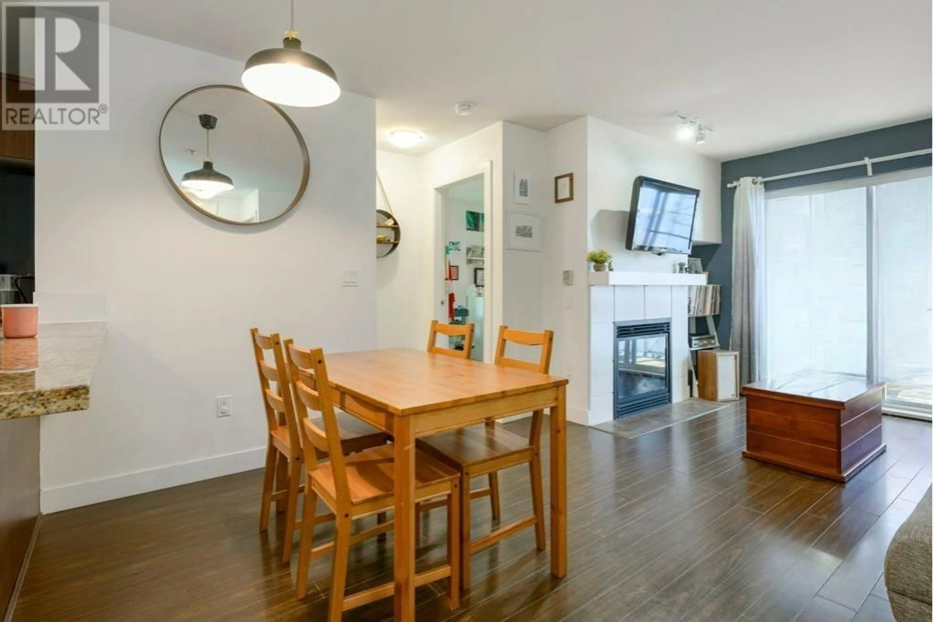 Dining room, wood/laminate floor for 207 - 3240 ST JOHNS STREET, Port Moody British Columbia V3H0C1