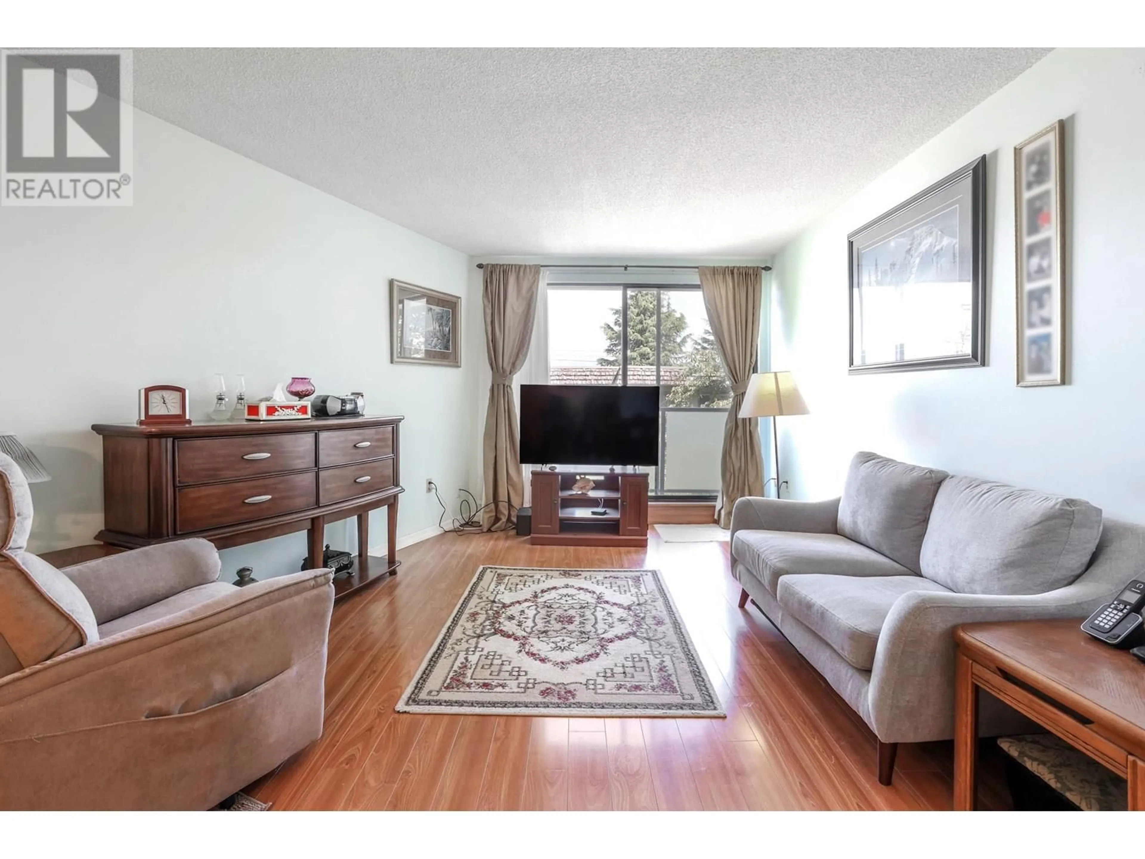 Living room with furniture, wood/laminate floor for #205 - 665 6TH AVENUE, Vancouver British Columbia V5T4J3