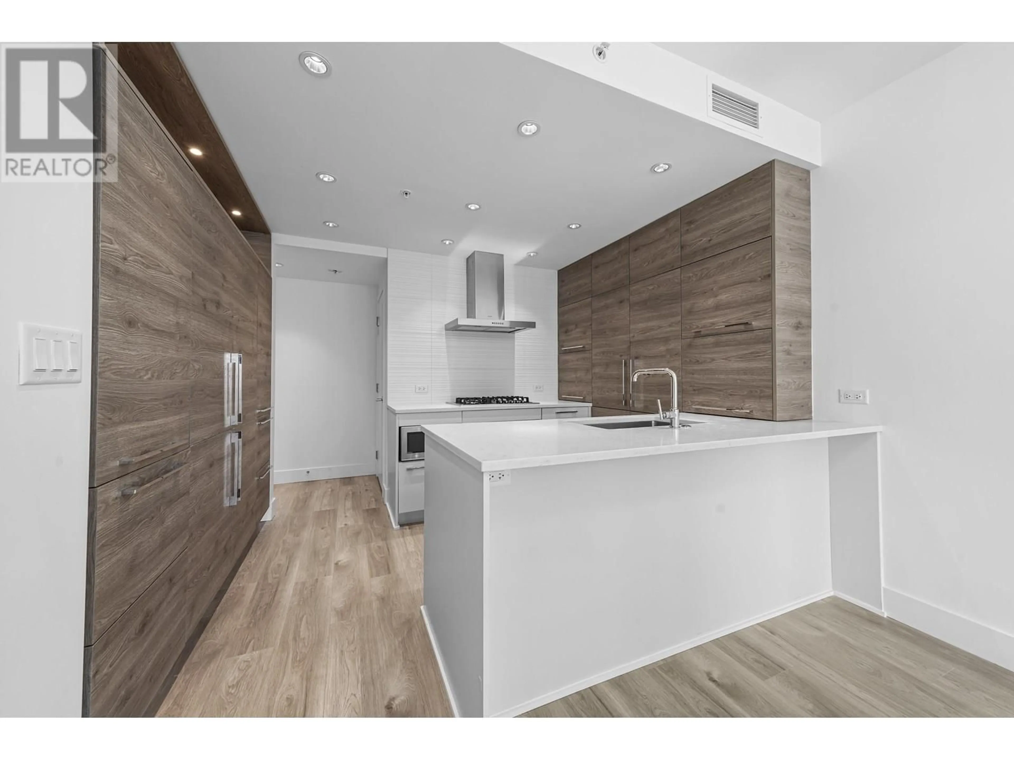 Open concept kitchen, wood/laminate floor for 1801 - 7303 NOBLE LANE, Burnaby British Columbia V3N0H2