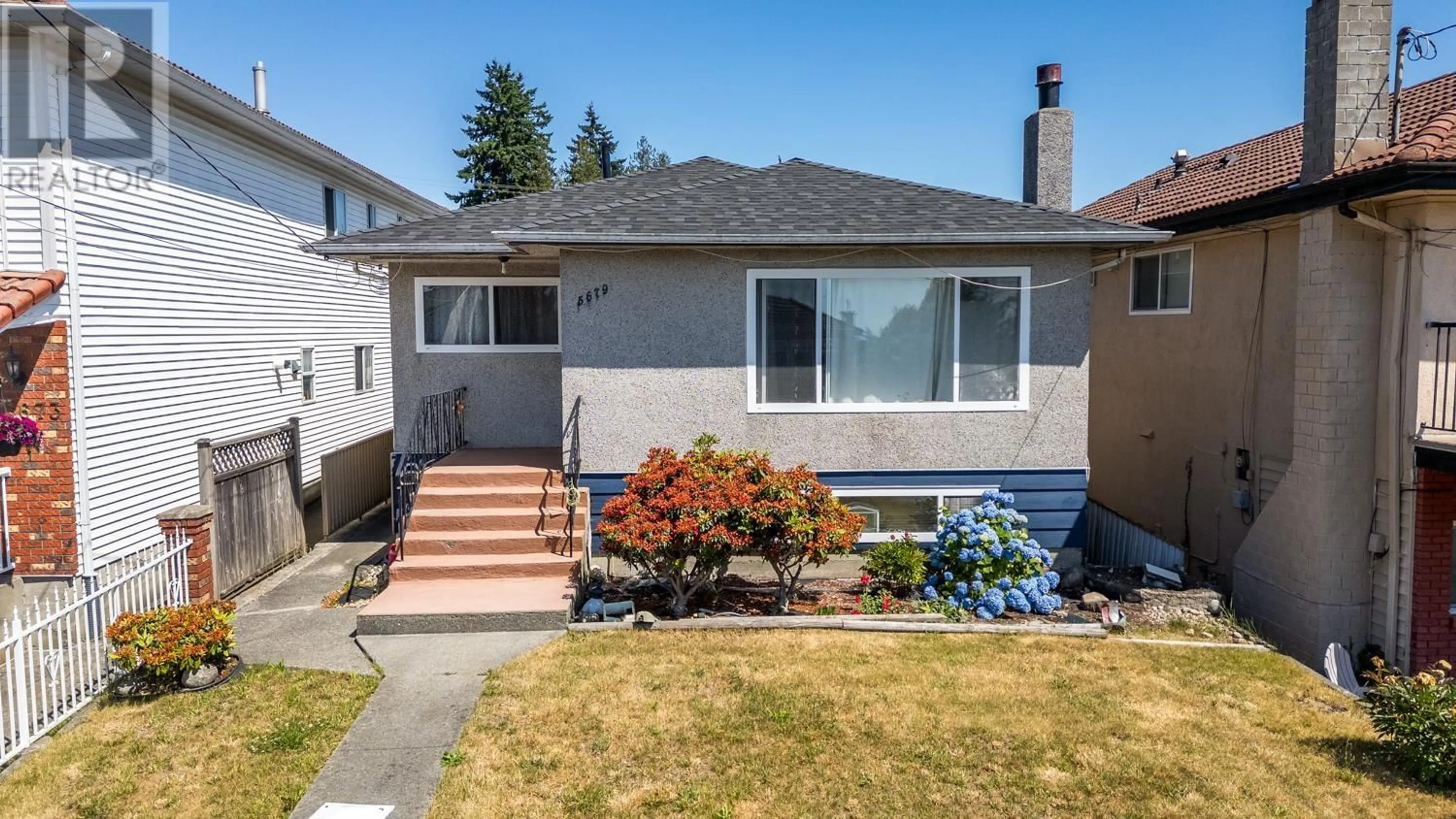 Home with vinyl exterior material, street for 5679 CLINTON STREET, Burnaby British Columbia V5J2M2