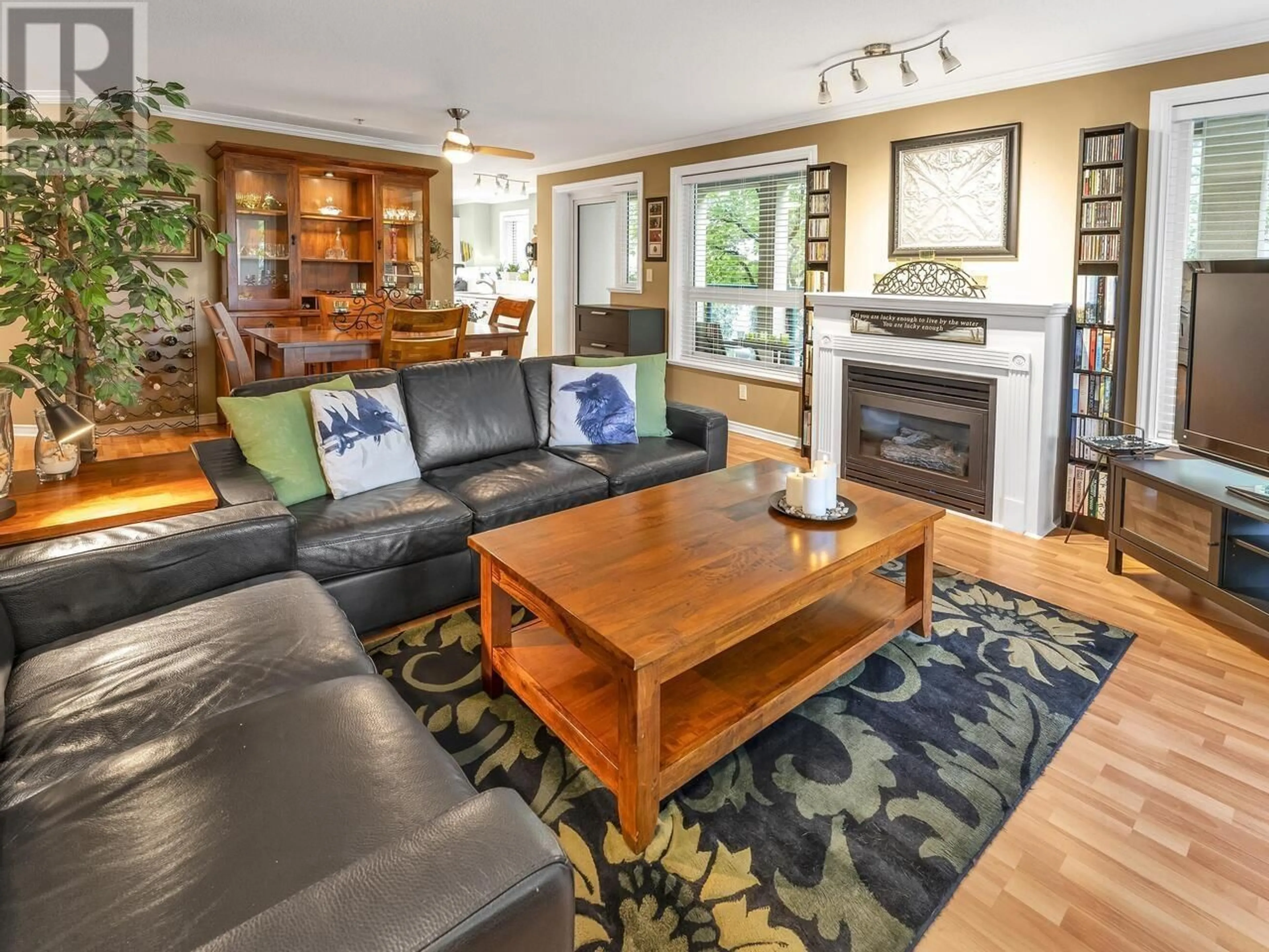Living room with furniture, wood/laminate floor for 207 - 12 LAGUNA COURT, New Westminster British Columbia V3M6W4