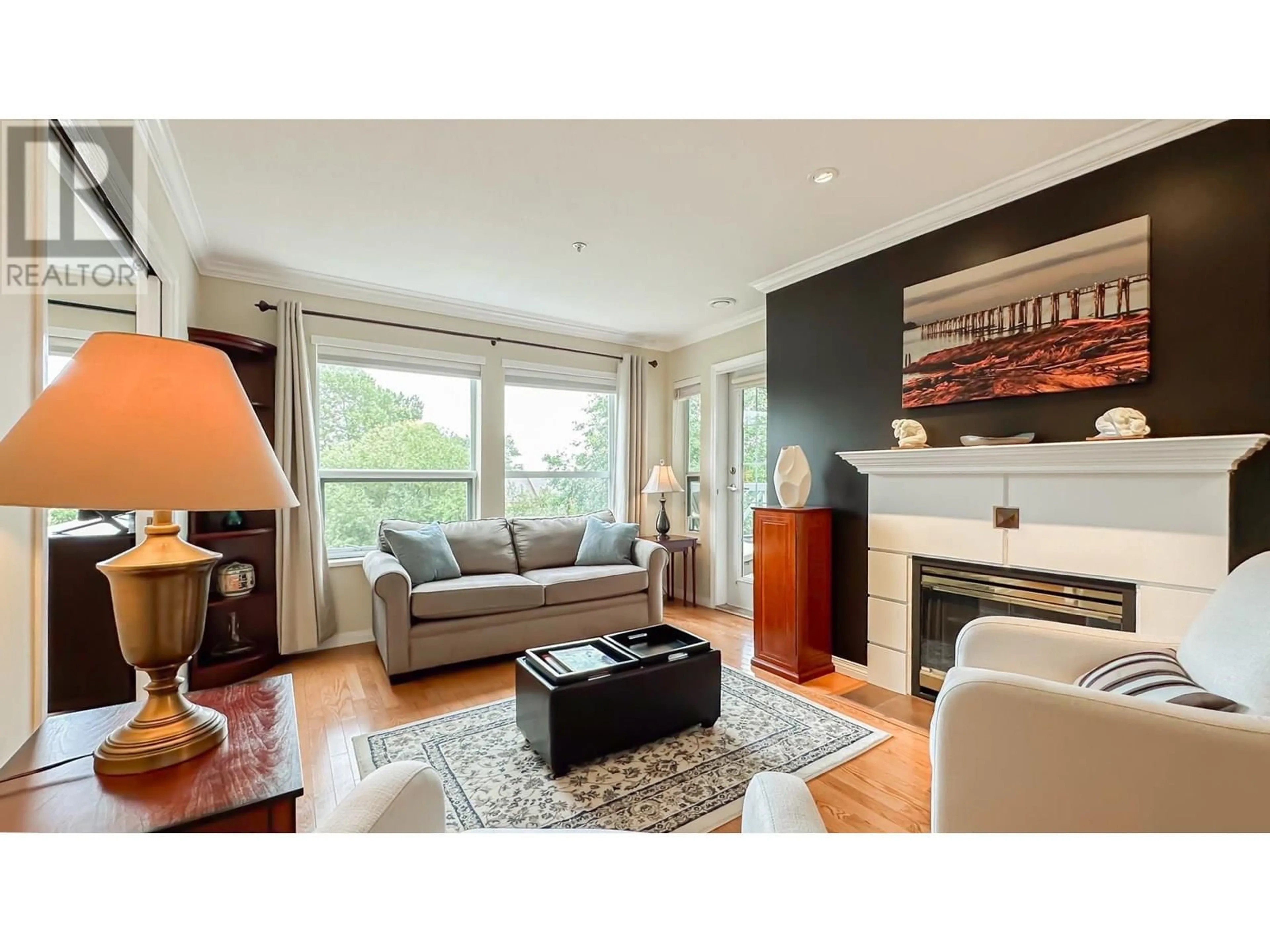 Living room with furniture, wood/laminate floor for 225 - 12931 RAILWAY AVENUE, Richmond British Columbia V7E6M5