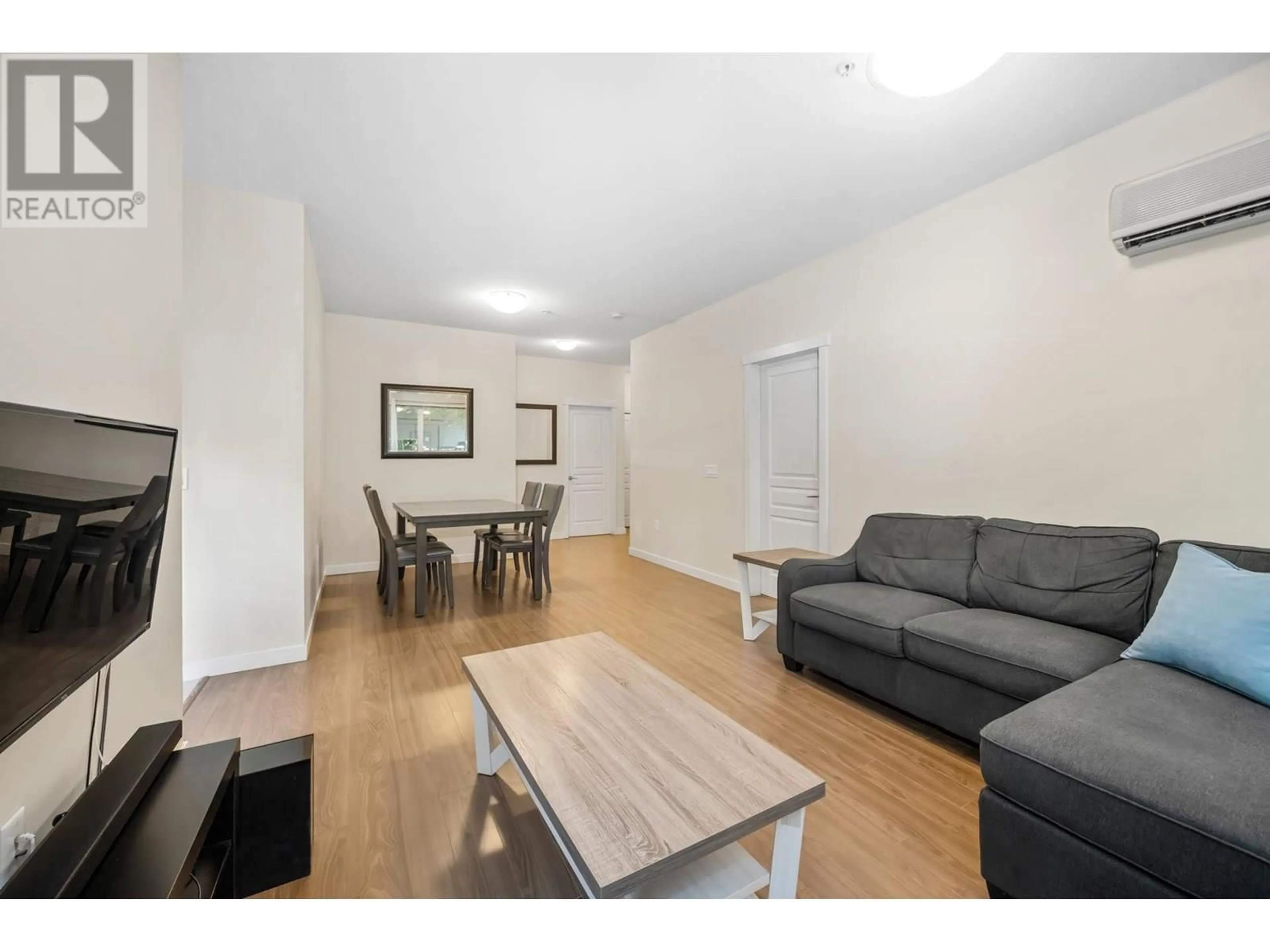 Living room with furniture, wood/laminate floor for 121 - 9399 ODLIN ROAD, Richmond British Columbia V6X0J6