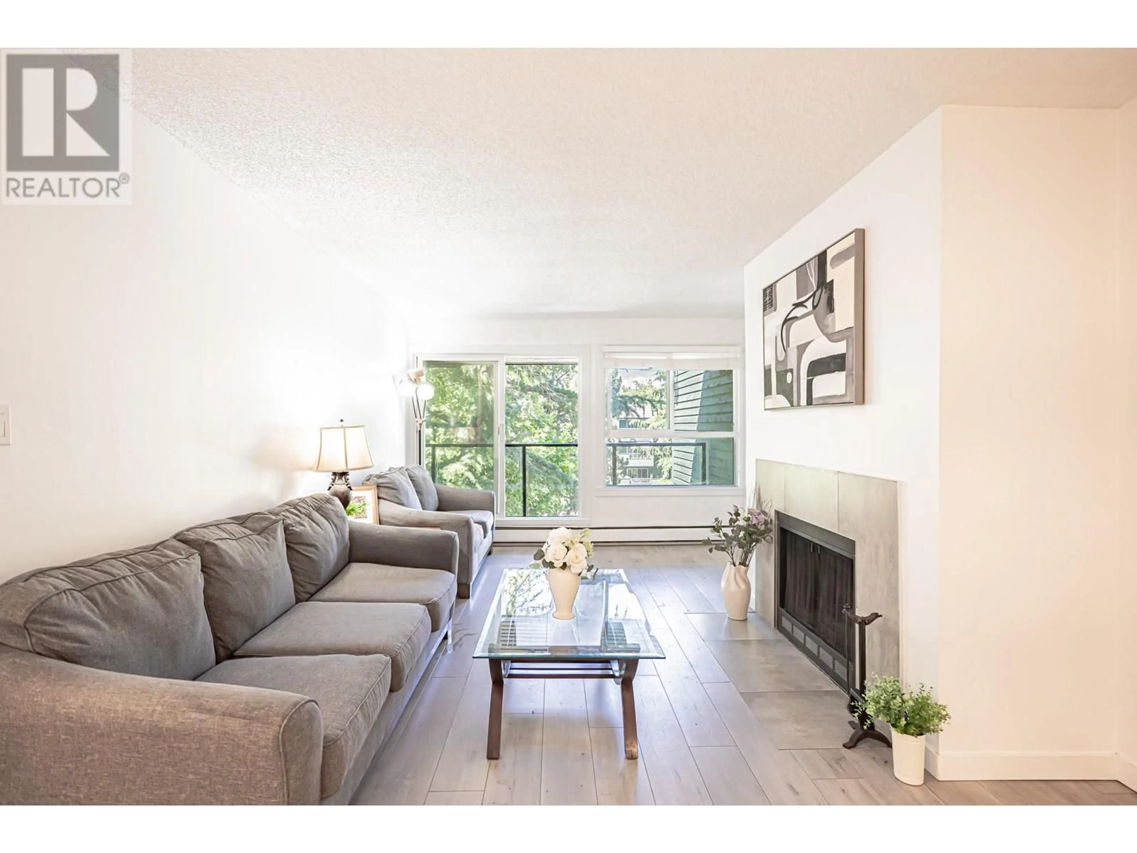 Living room with furniture, wood/laminate floor for 322 - 8591 WESTMINSTER HIGHWAY, Richmond British Columbia V6X3E2