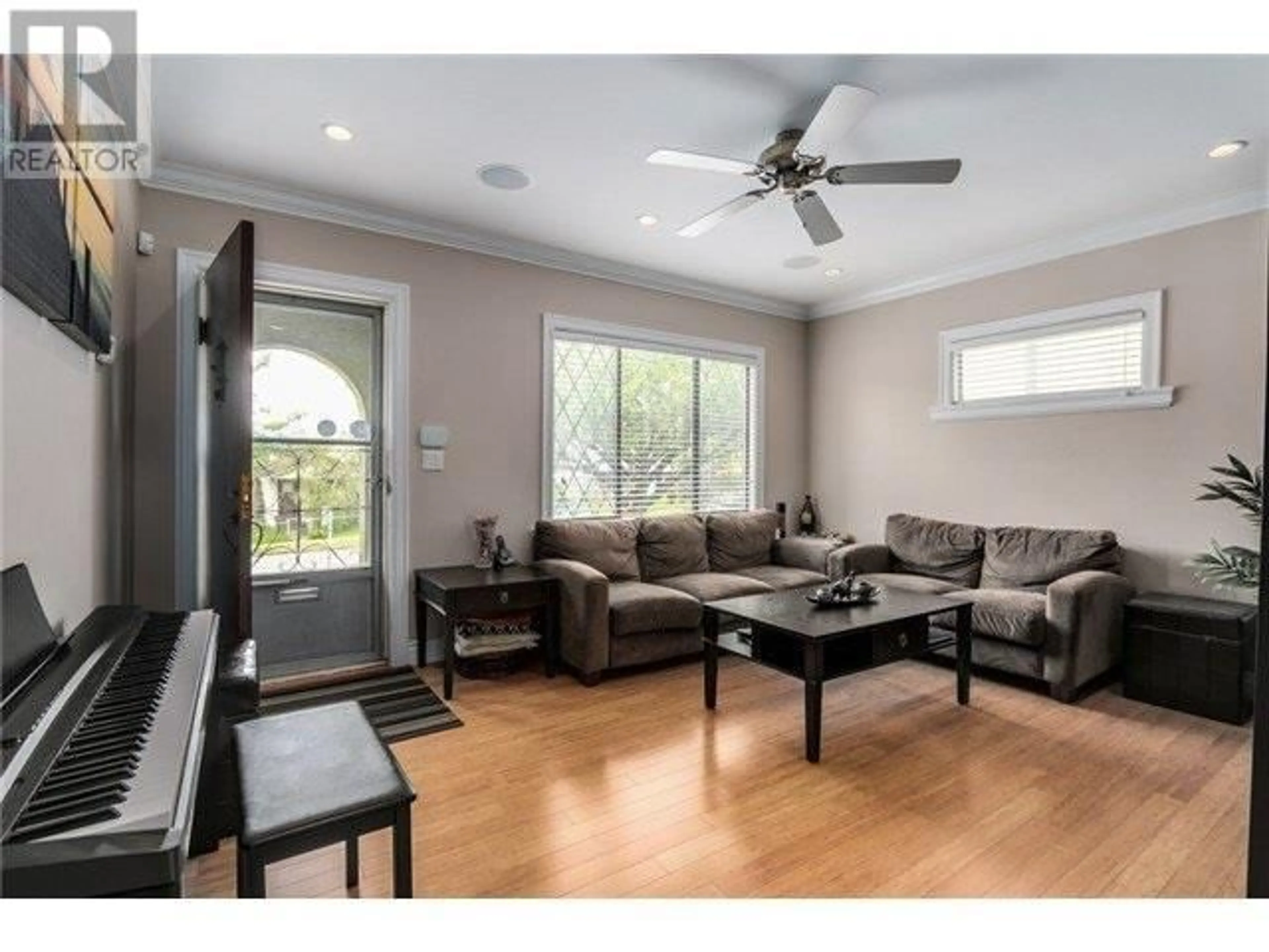 Living room with furniture, wood/laminate floor for 1942 49TH AVENUE, Vancouver British Columbia V5P1T3