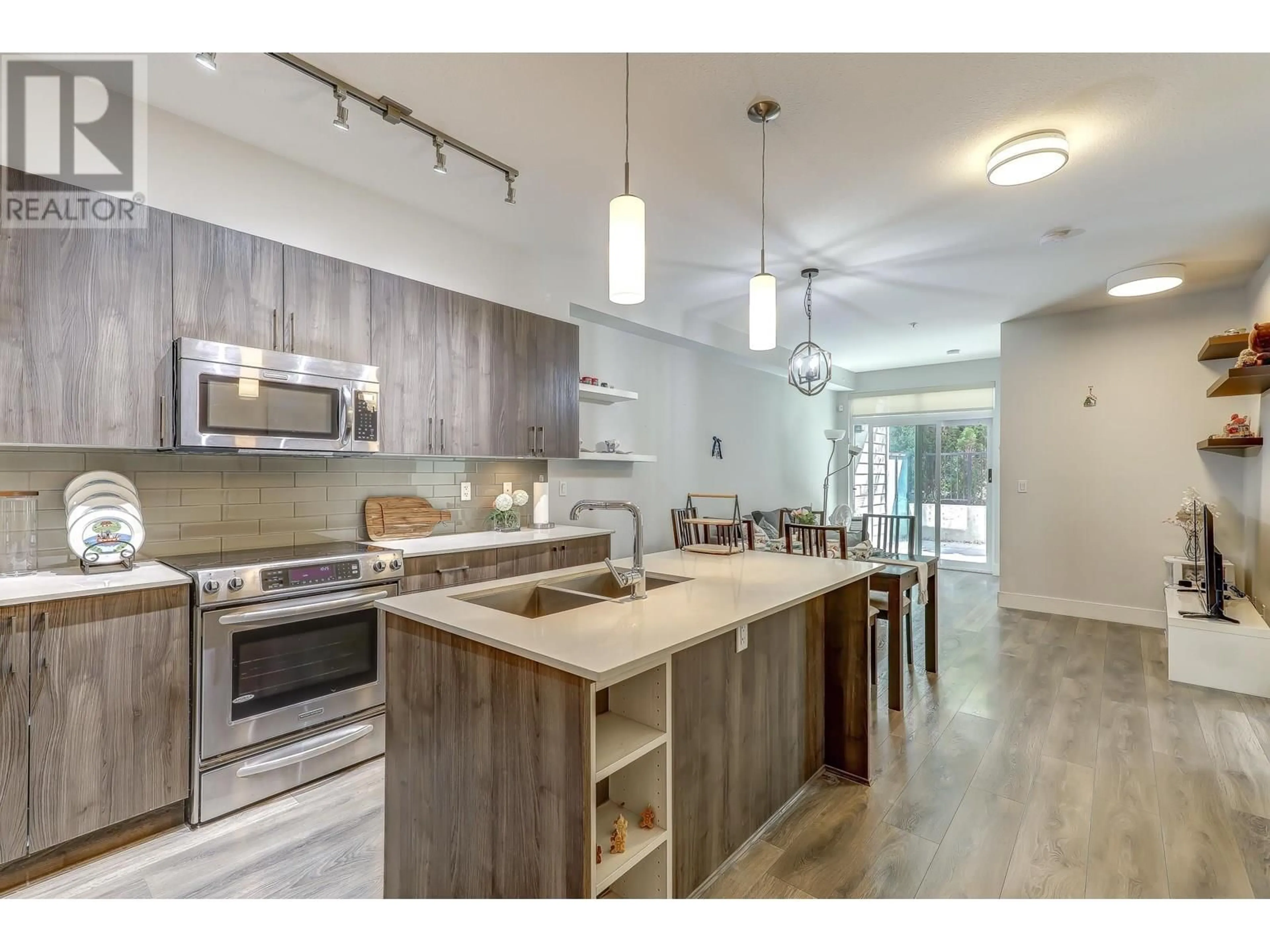 Open concept kitchen, wood/laminate floor for 103 - 630 COMO LAKE AVENUE, Coquitlam British Columbia V3J0E4