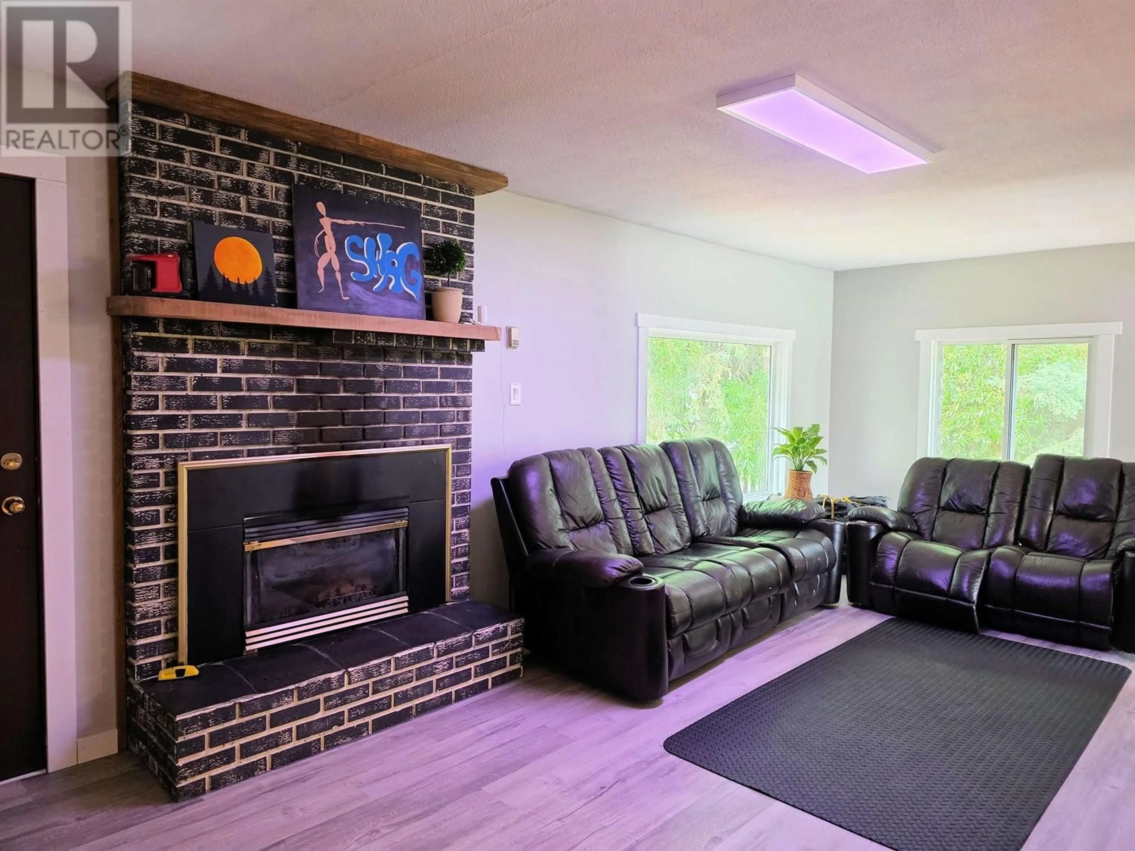 Living room with furniture, wood/laminate floor for 2512 DOMINION AVENUE, Houston British Columbia V0J1Z0