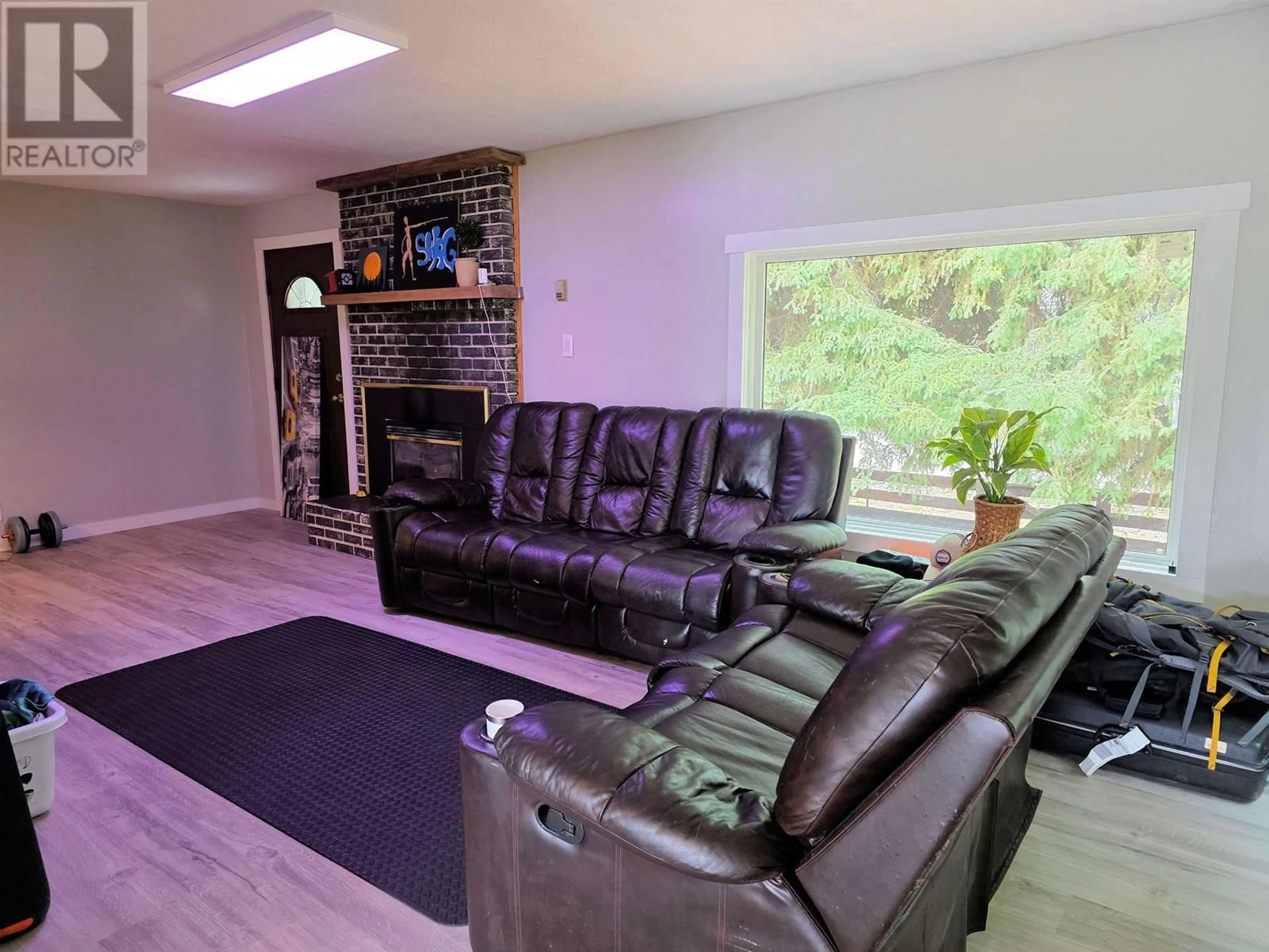 Living room with furniture, wood/laminate floor for 2512 DOMINION AVENUE, Houston British Columbia V0J1Z0