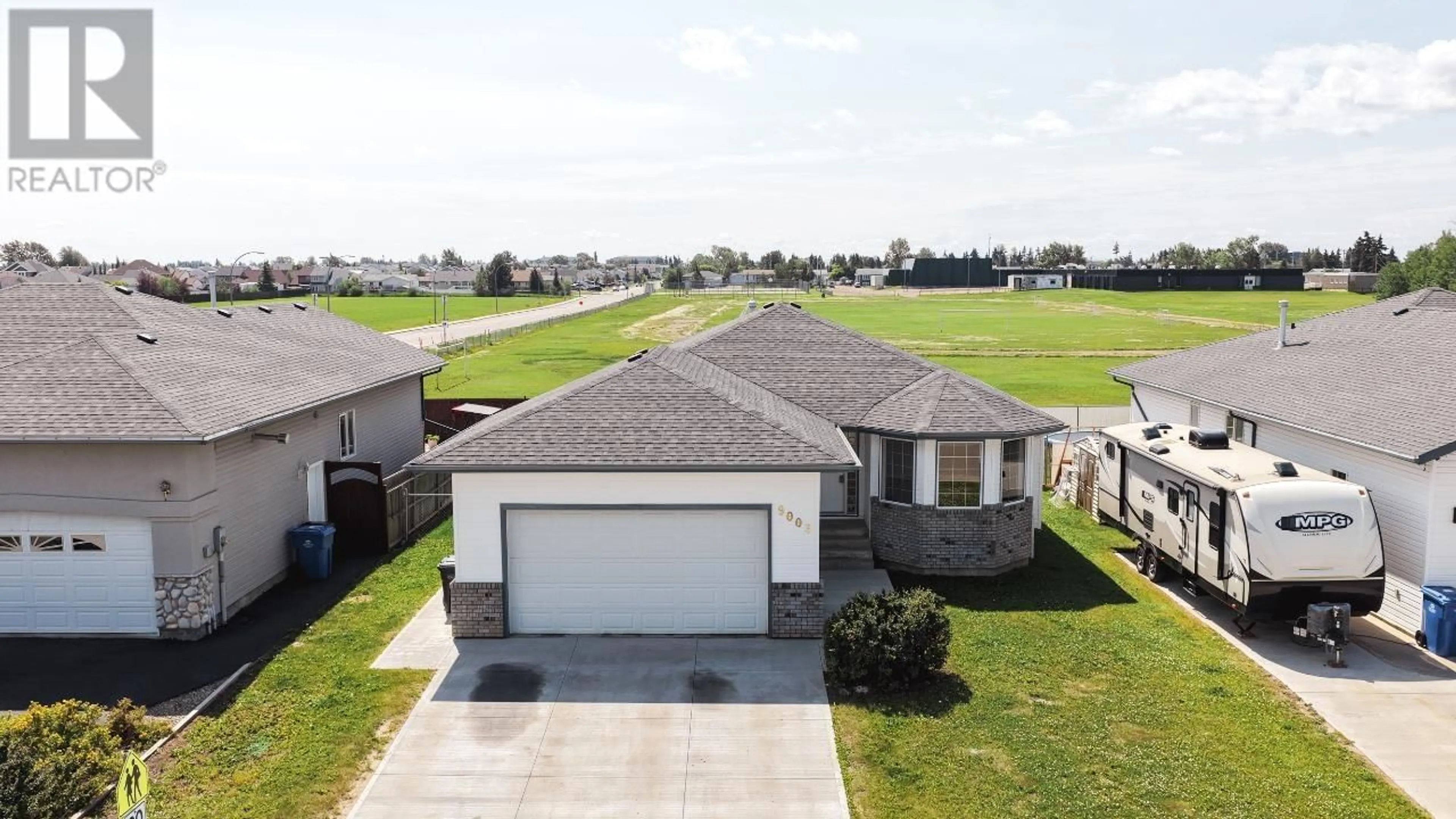 A pic from outside/outdoor area/front of a property/back of a property/a pic from drone, unknown for 9003 111 AVENUE, Fort St. John British Columbia V1J6Z2