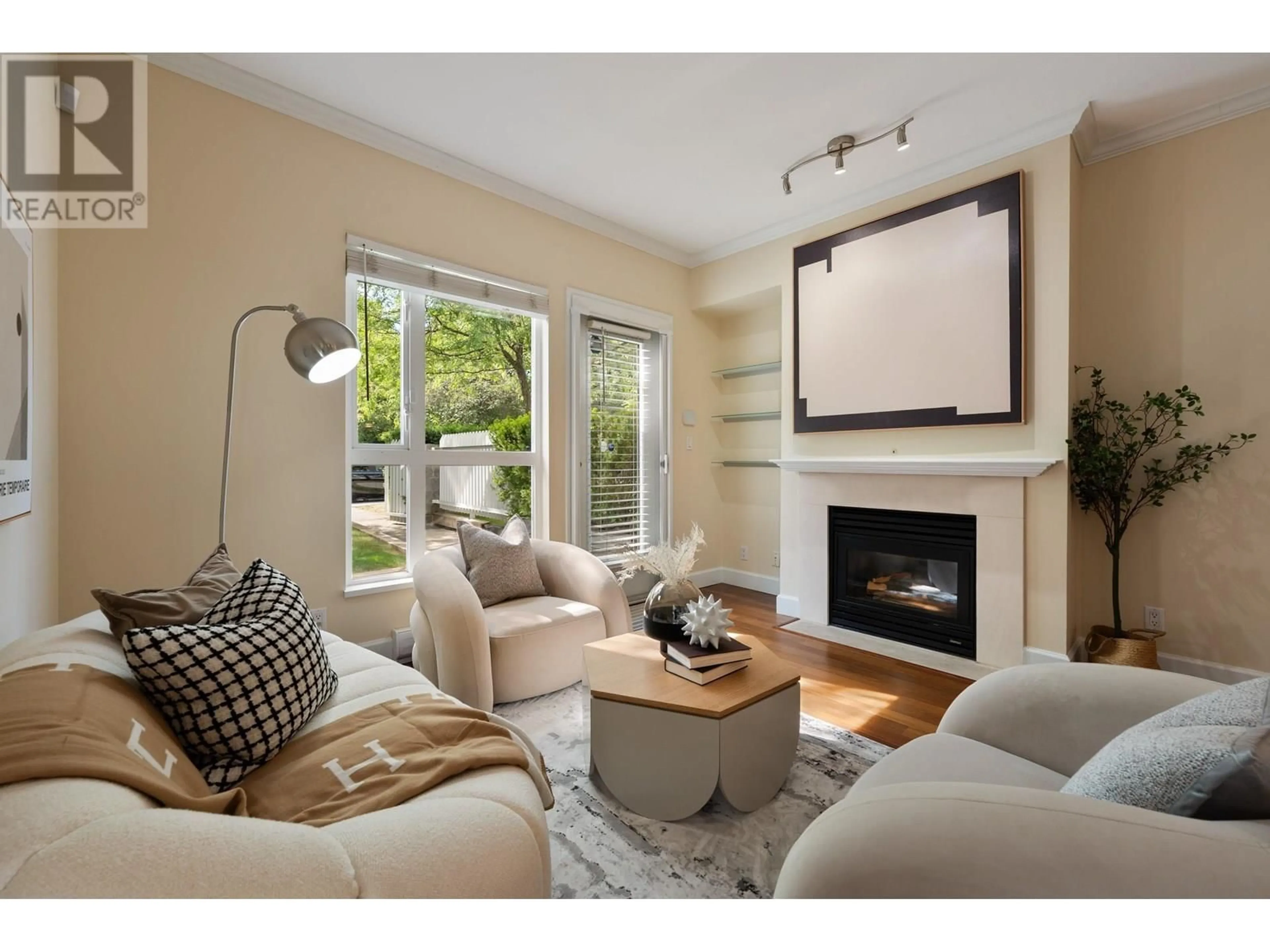 Living room with furniture, wood/laminate floor for 103 - 6198 ASH STREET, Vancouver British Columbia V5Z3G9